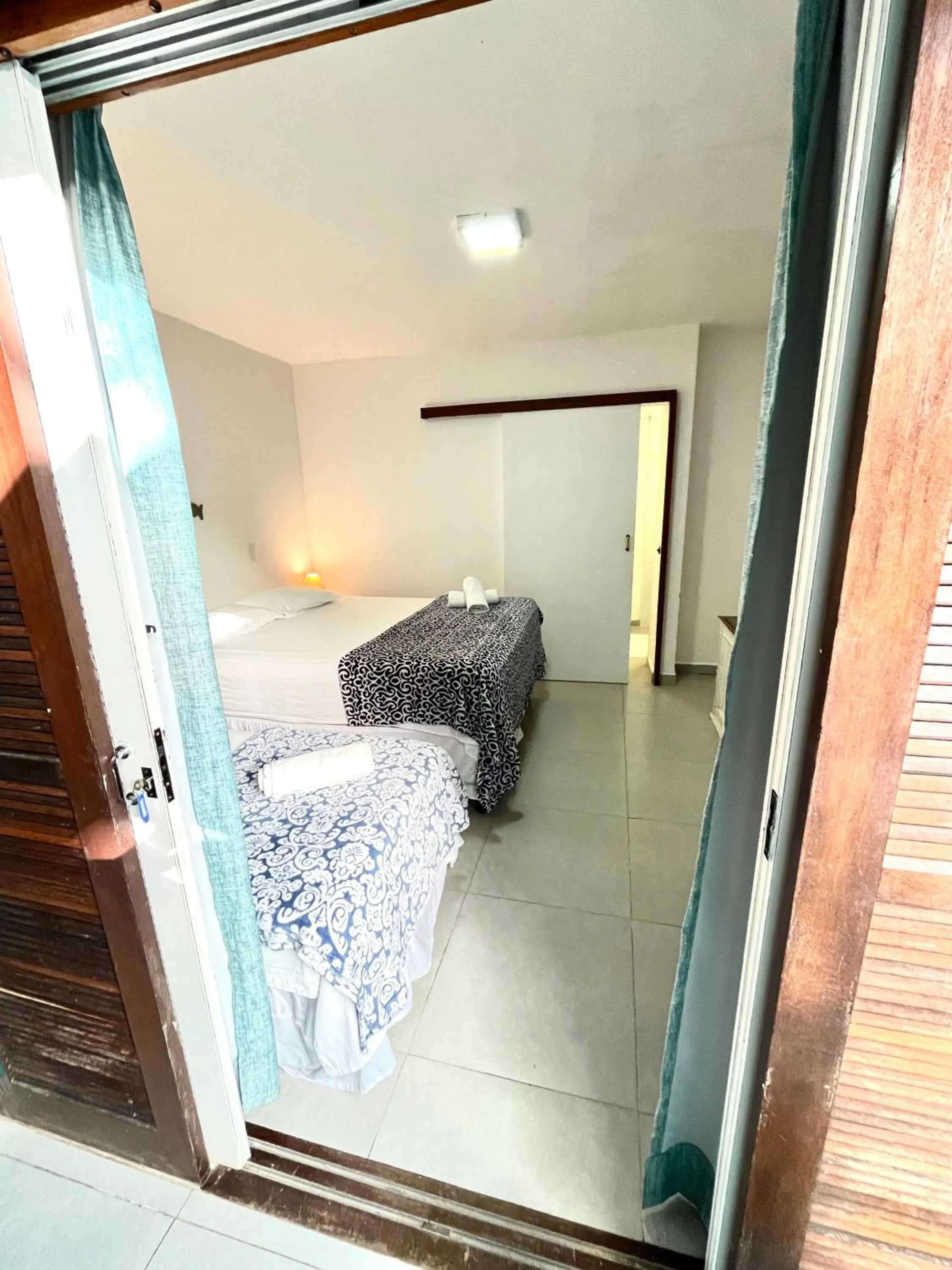 Bed in Pousada Tô na Praia Juquehy