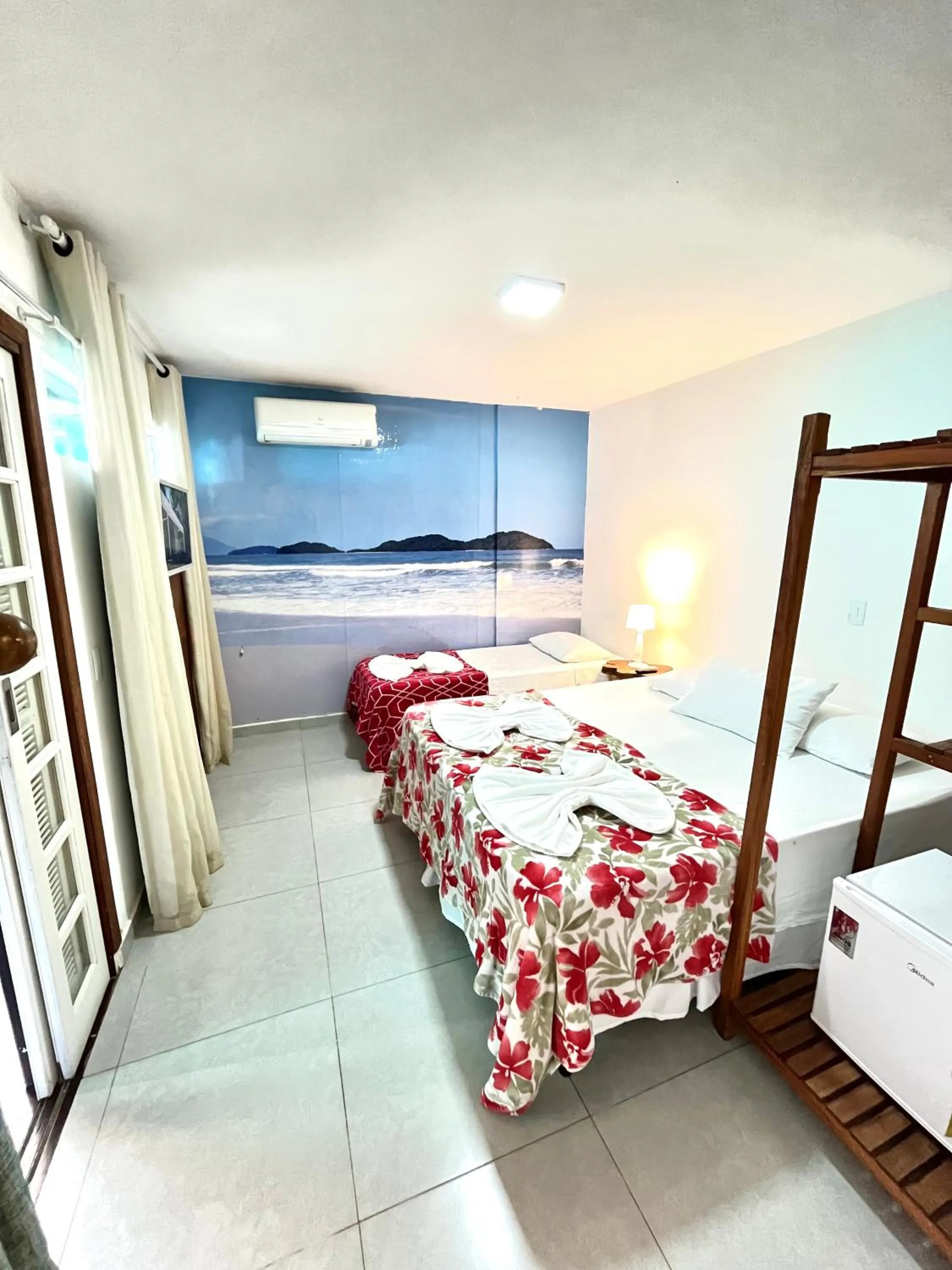 Bed in Pousada Tô na Praia Juquehy