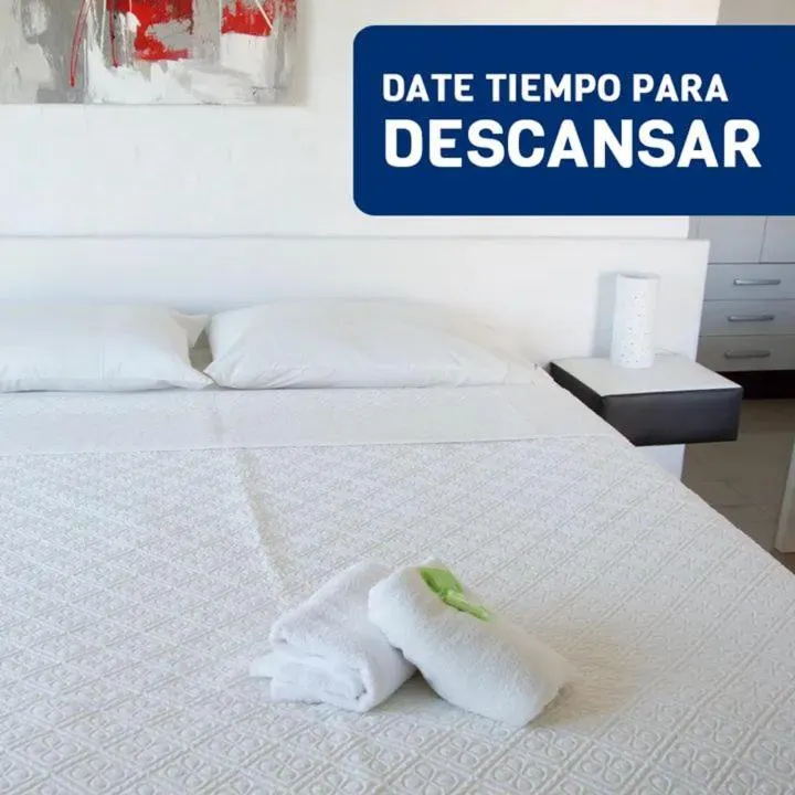 Bed in Palmeras Beach Hotel