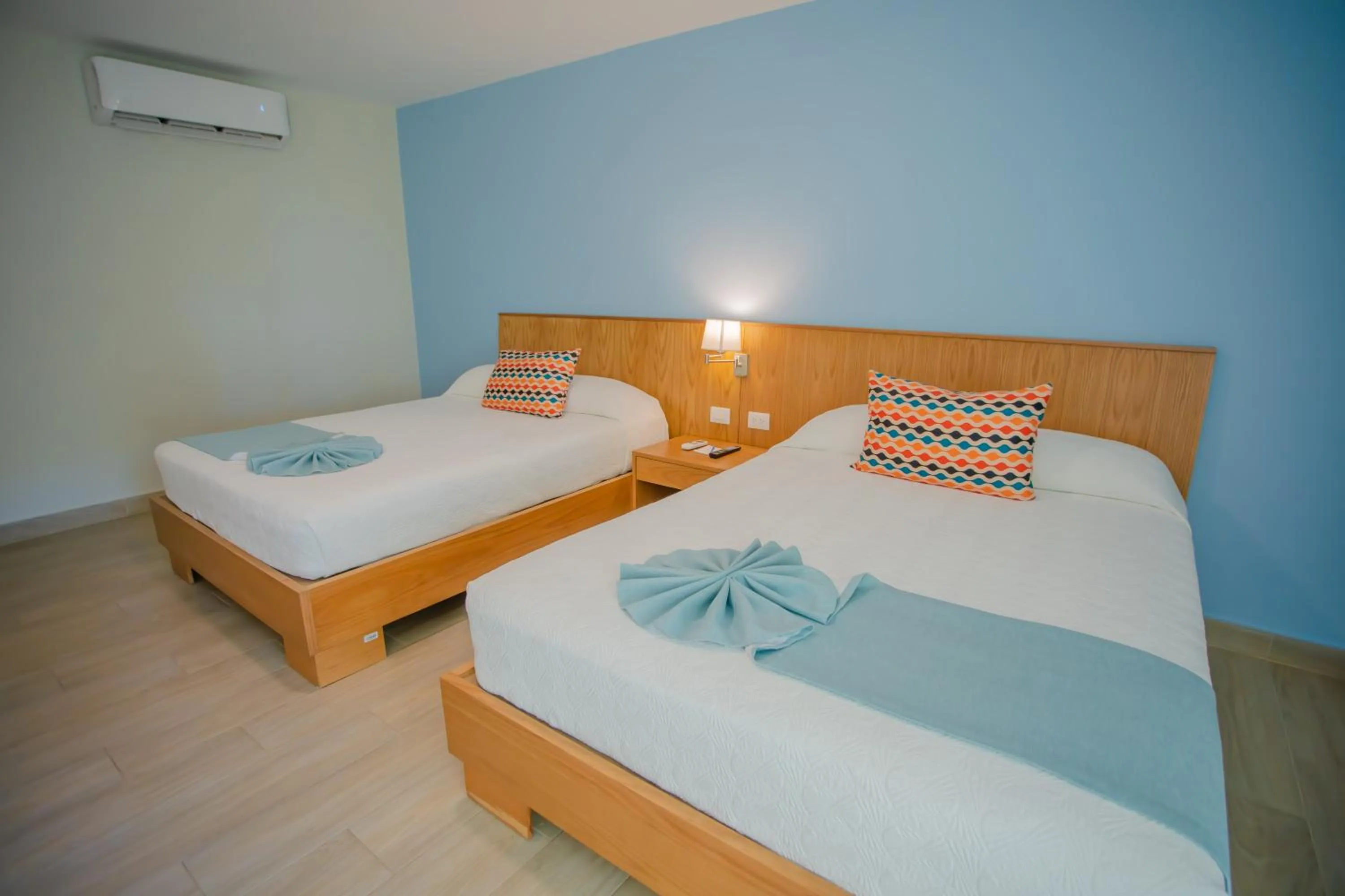 Bed in Coral Costa Caribe Beach Resort - All Inclusive