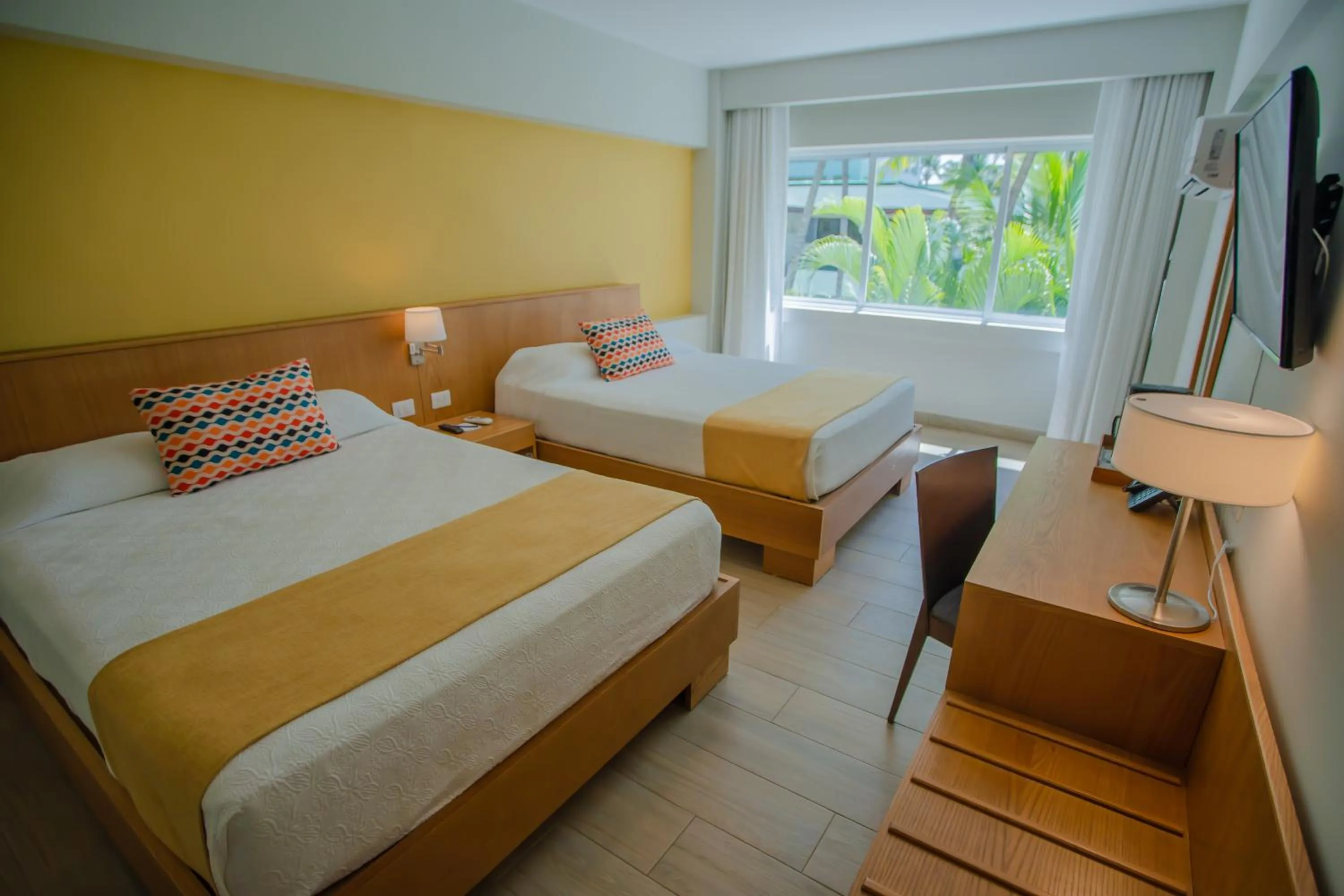 Bed in Coral Costa Caribe Beach Resort - All Inclusive