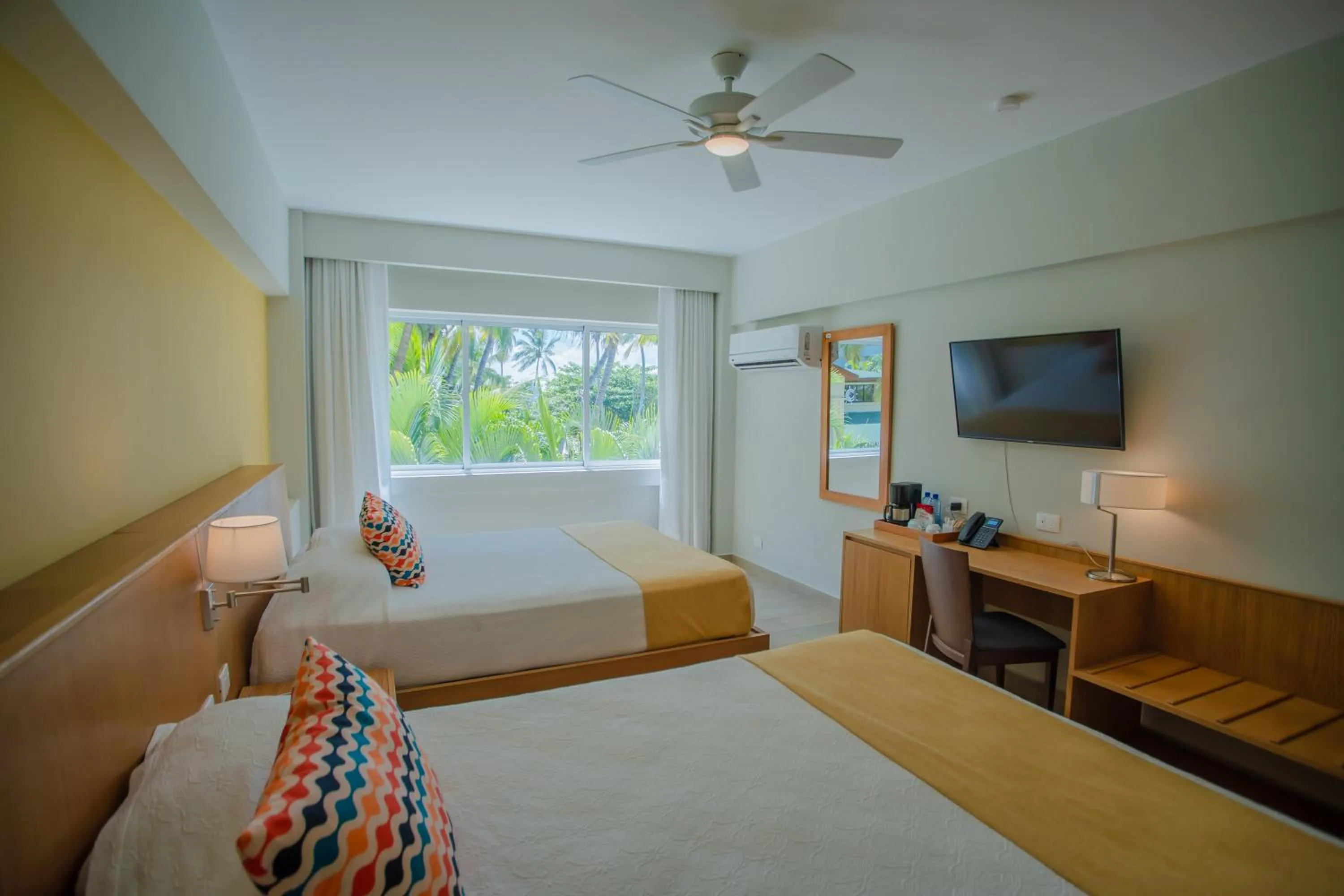 Bed in Coral Costa Caribe Beach Resort - All Inclusive