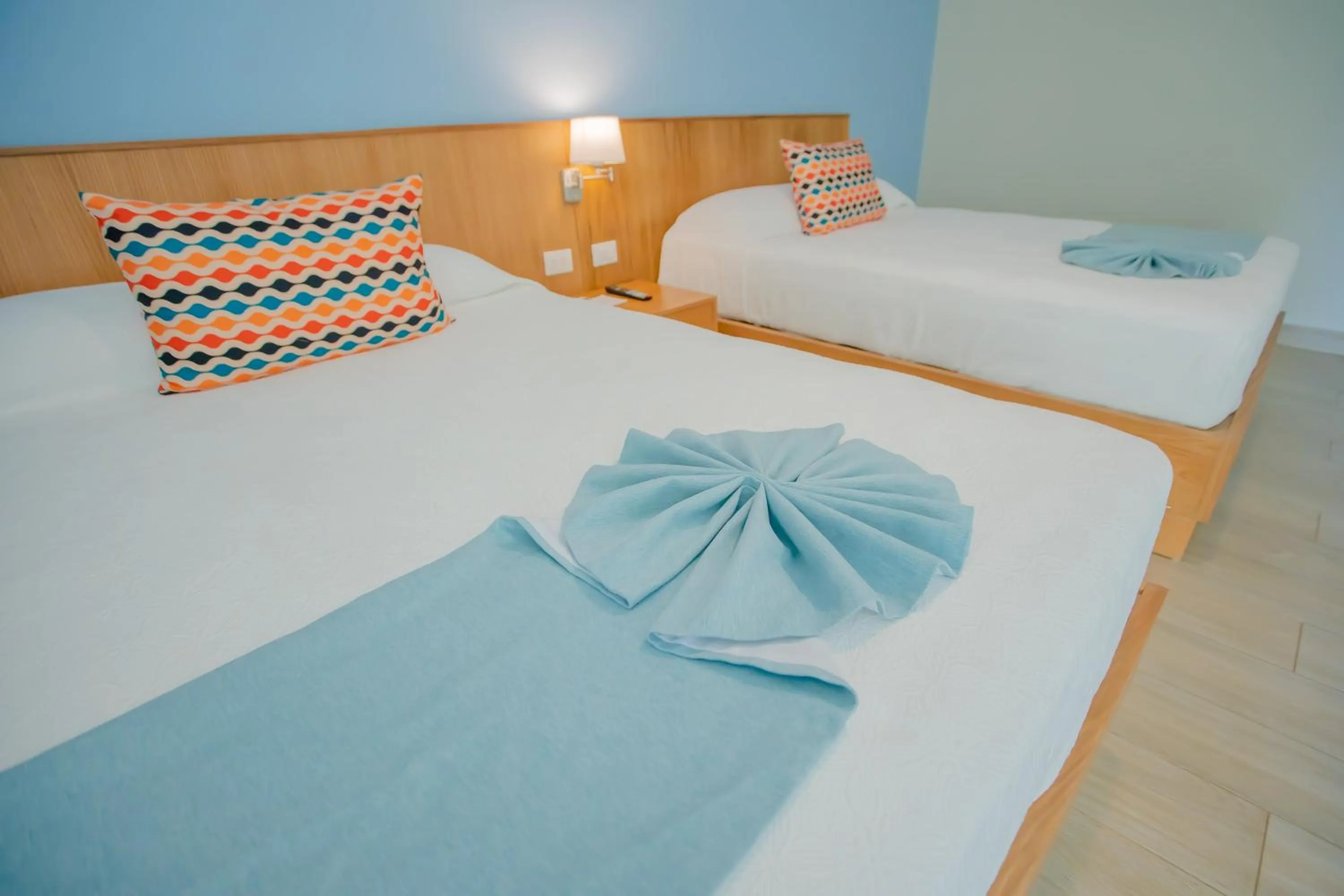 Bed in Coral Costa Caribe Beach Resort - All Inclusive