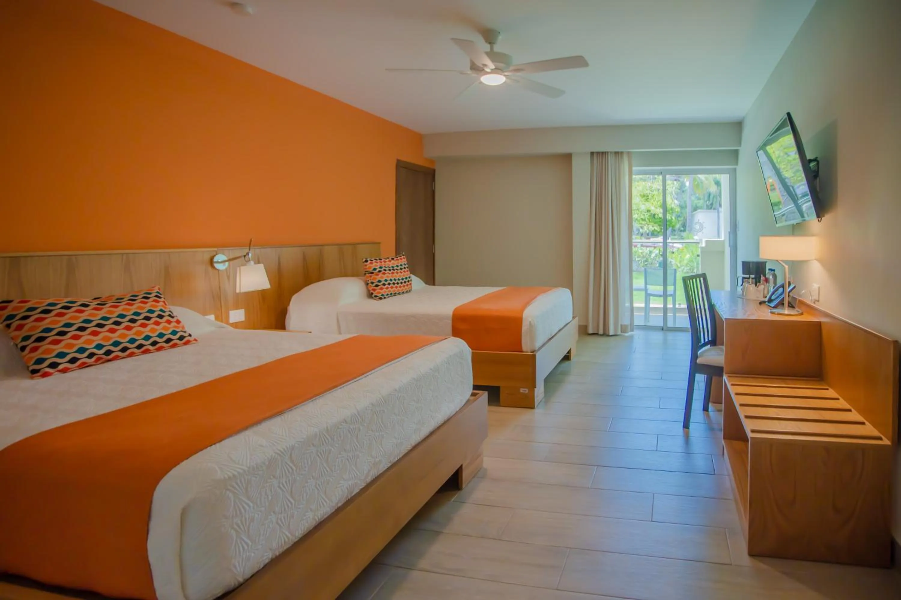 Bed in Coral Costa Caribe Beach Resort - All Inclusive