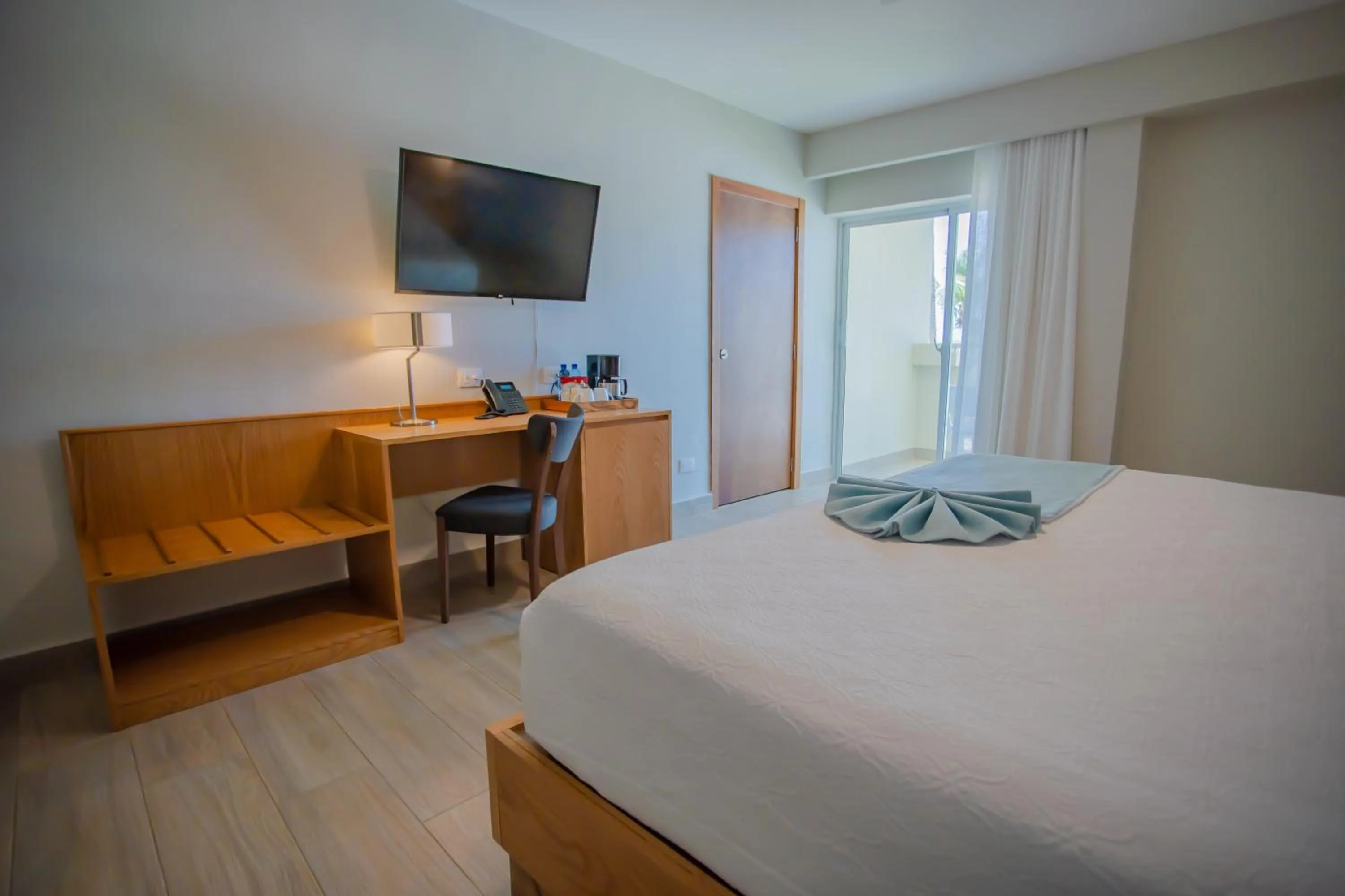 Bed in Coral Costa Caribe Beach Resort - All Inclusive