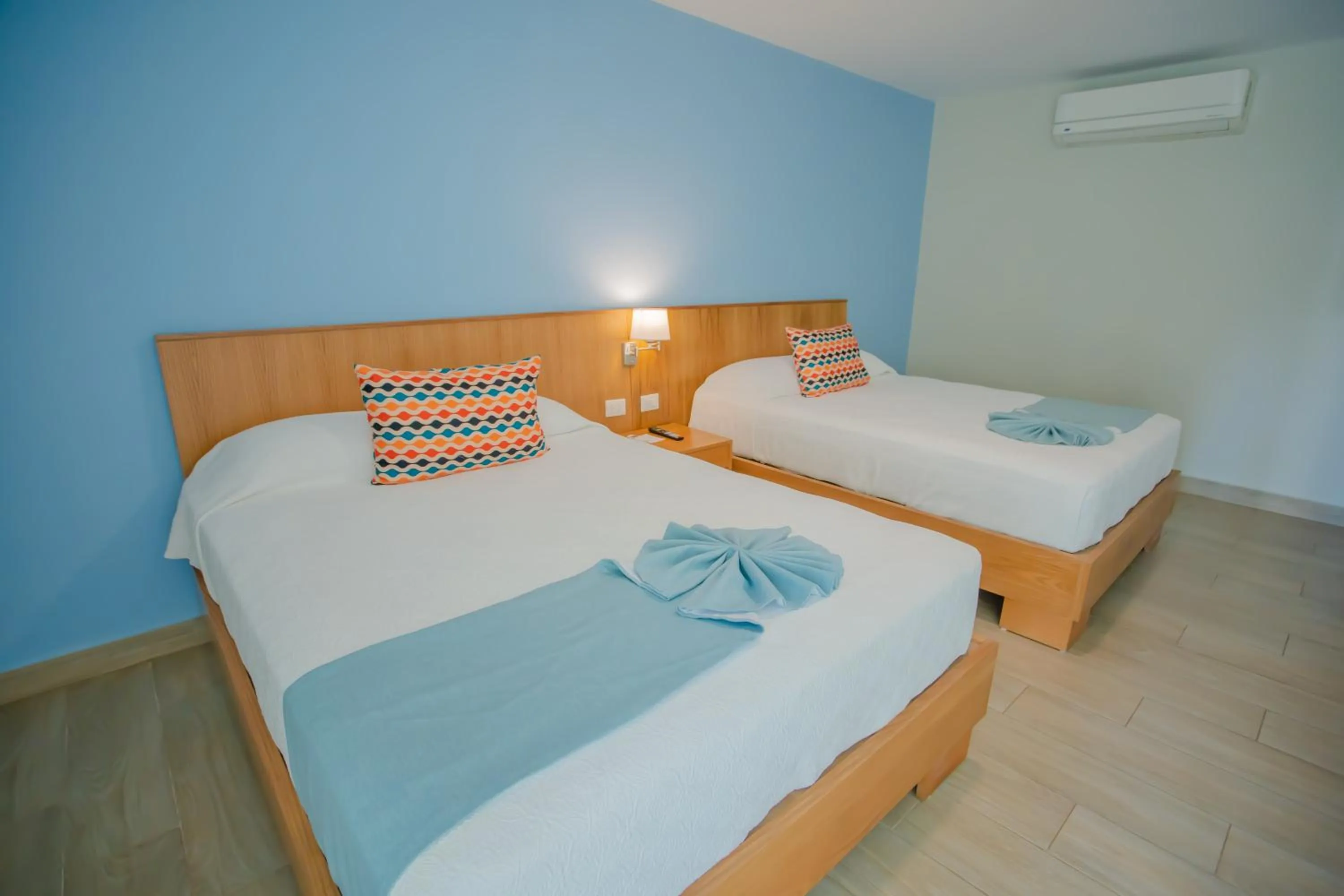 Bed in Coral Costa Caribe Beach Resort - All Inclusive