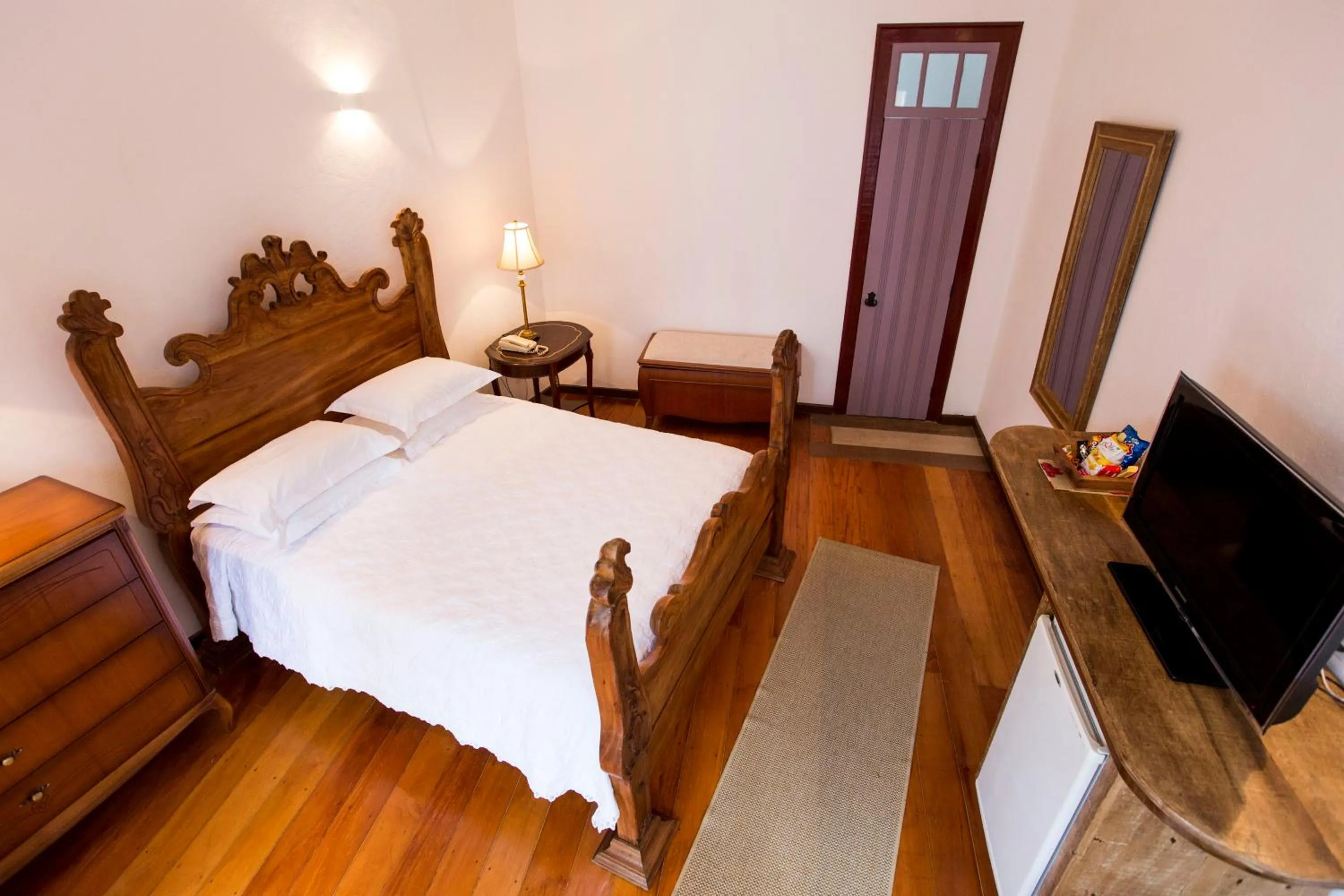 Bed in Pousada Pequena Tiradentes