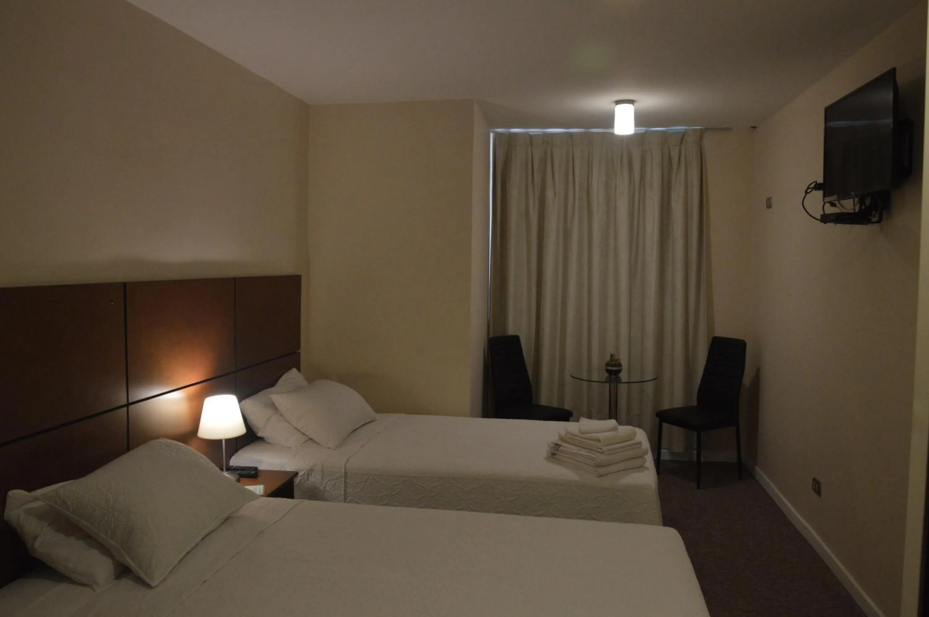 Bed in Origen Apart-Hotel
