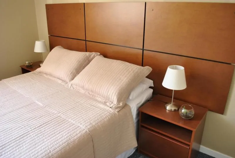 Bed in Origen Apart-Hotel