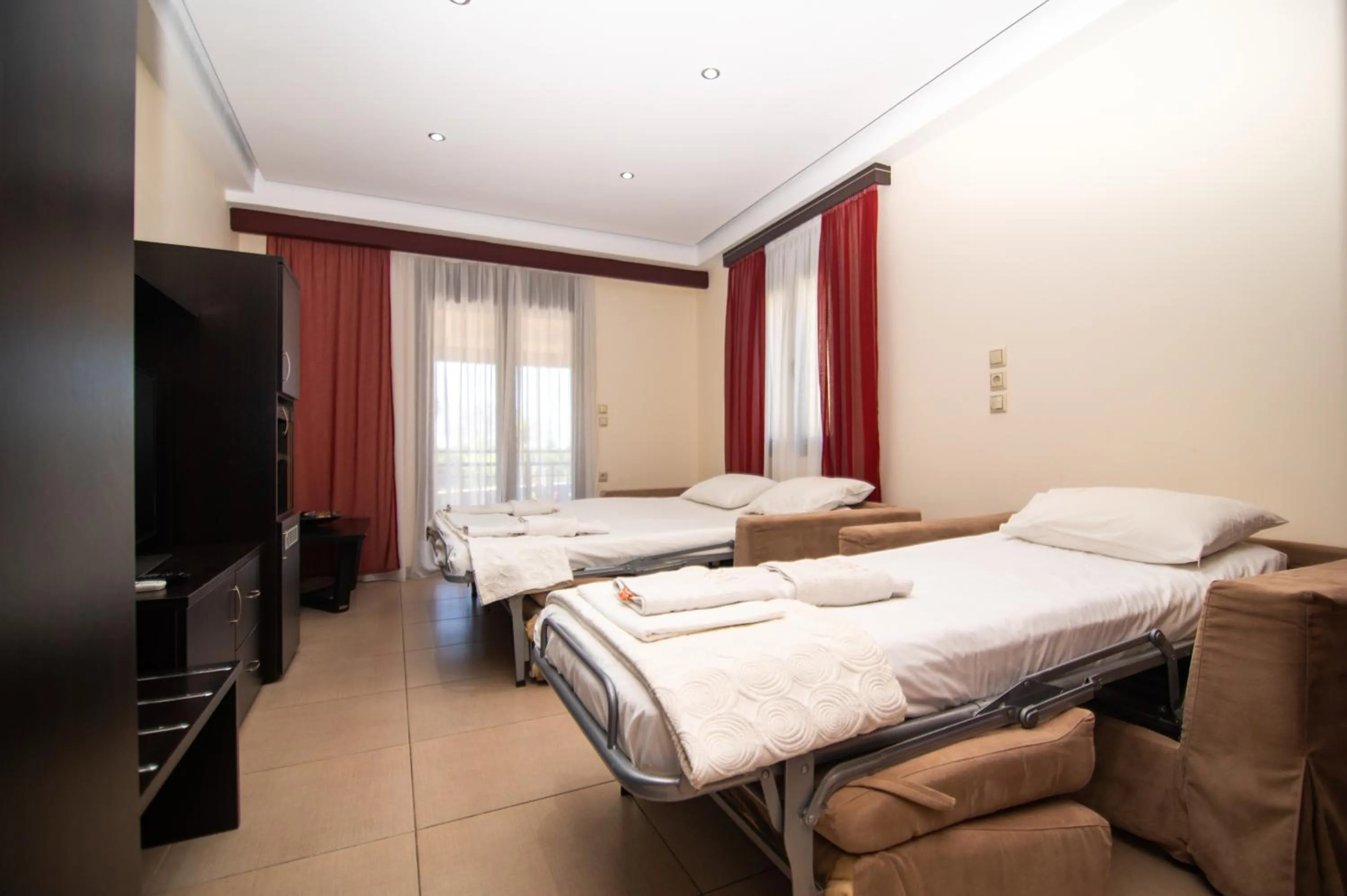 Bed in Riviera Perdika Hotel