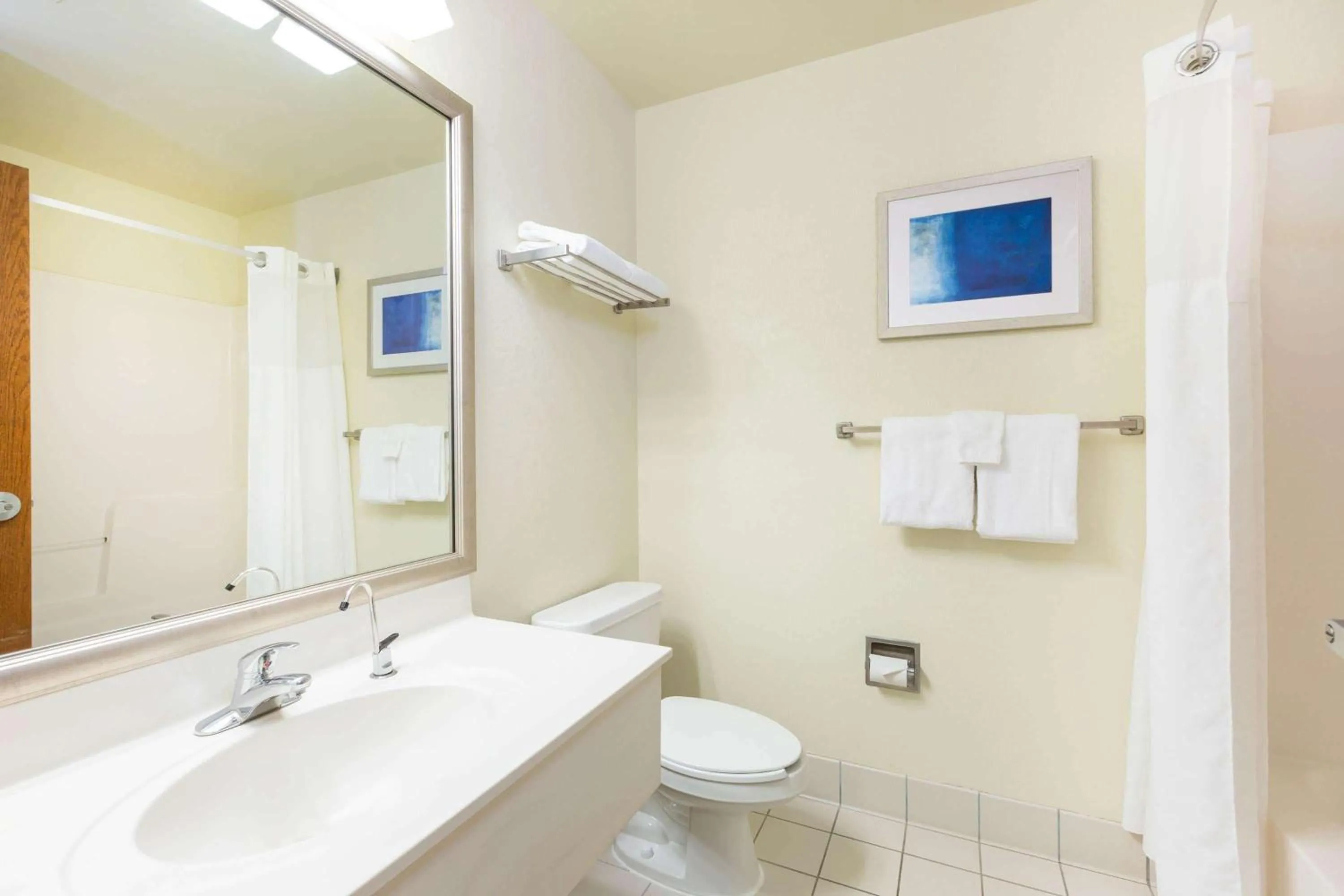 Bathroom in Baymont by Wyndham Des Moines Airport
