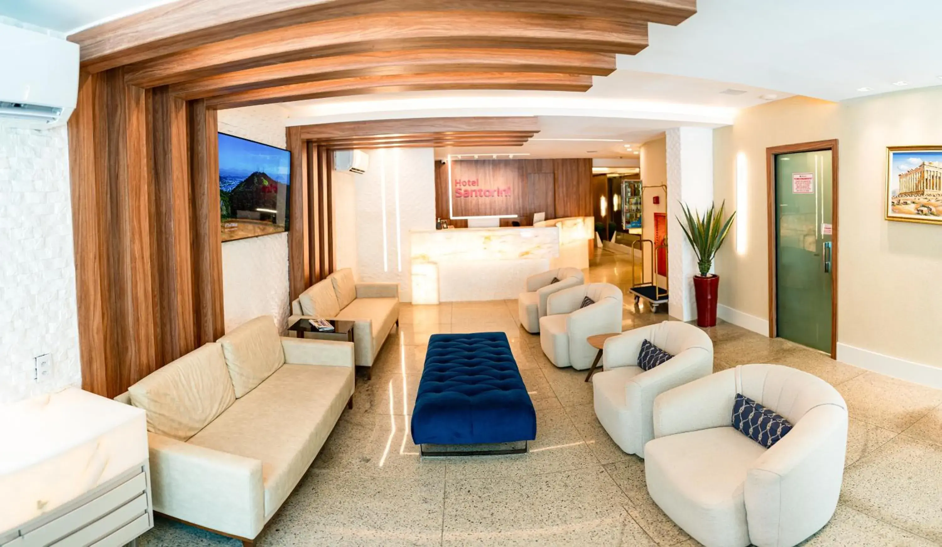 Communal lounge/ TV room, Bed in Hotel Santorini Communal lounge/ TV room, Bed in Hotel Santorini