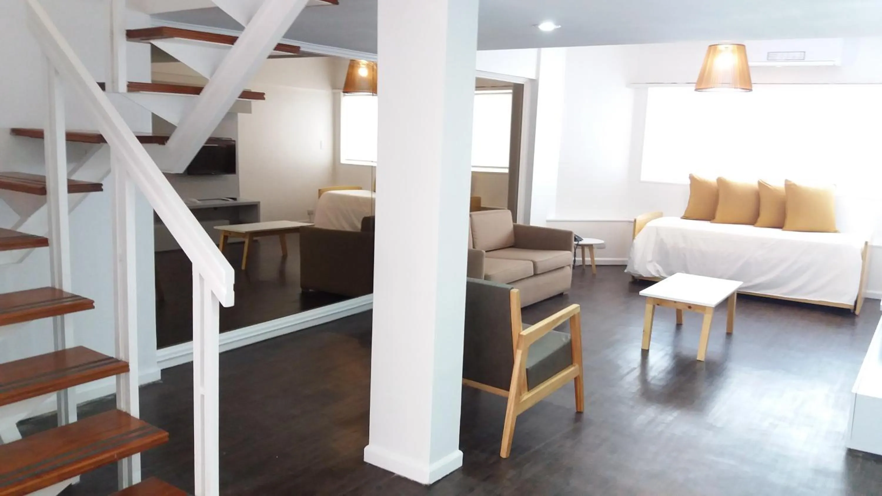 Living room, Bed in Alquileres Temporarios by CLH Rentals