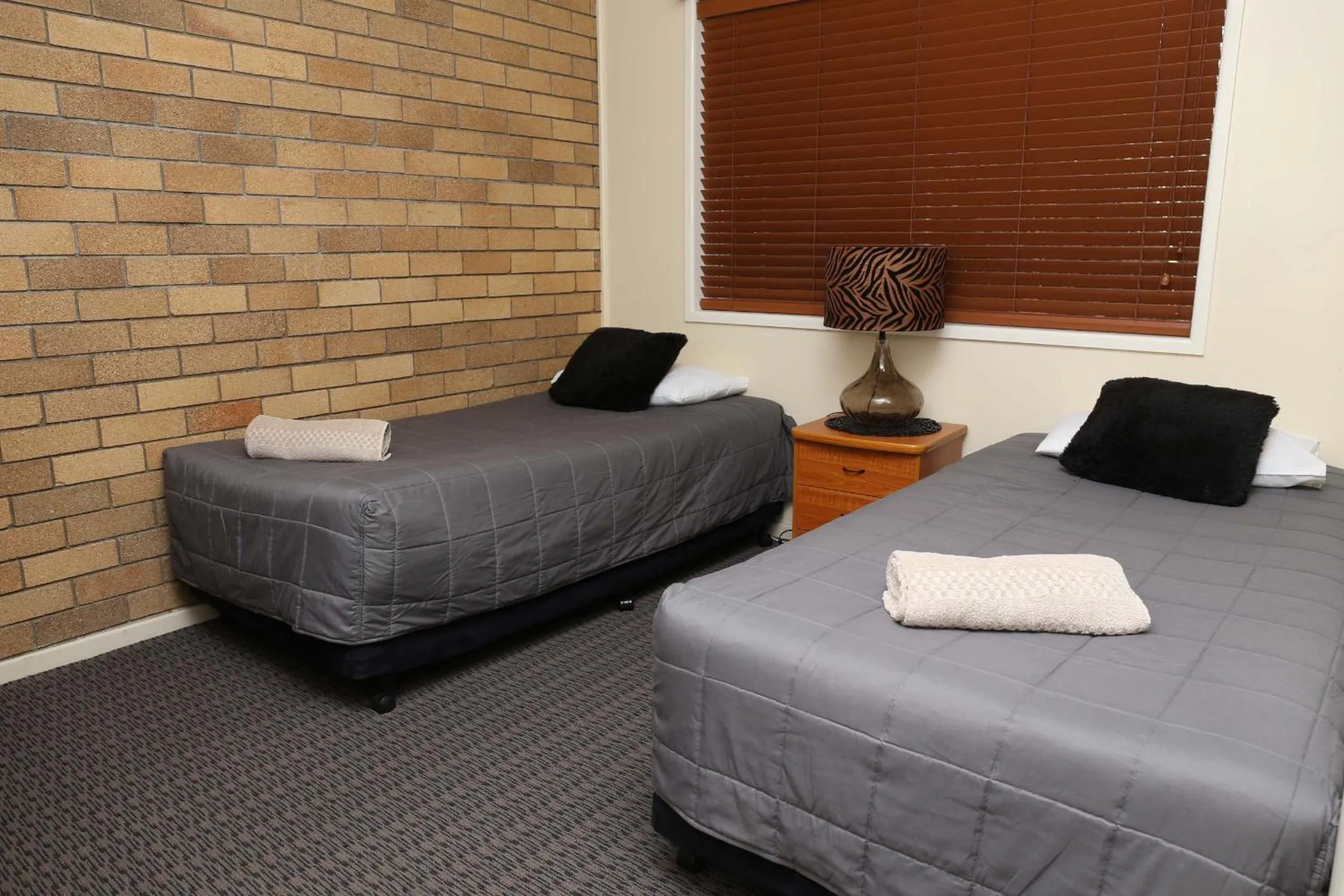 Bed in Westwood Motor Inn