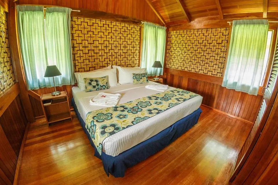 Photo of the whole room, Bed in Kokopo Beach Bungalow Resort