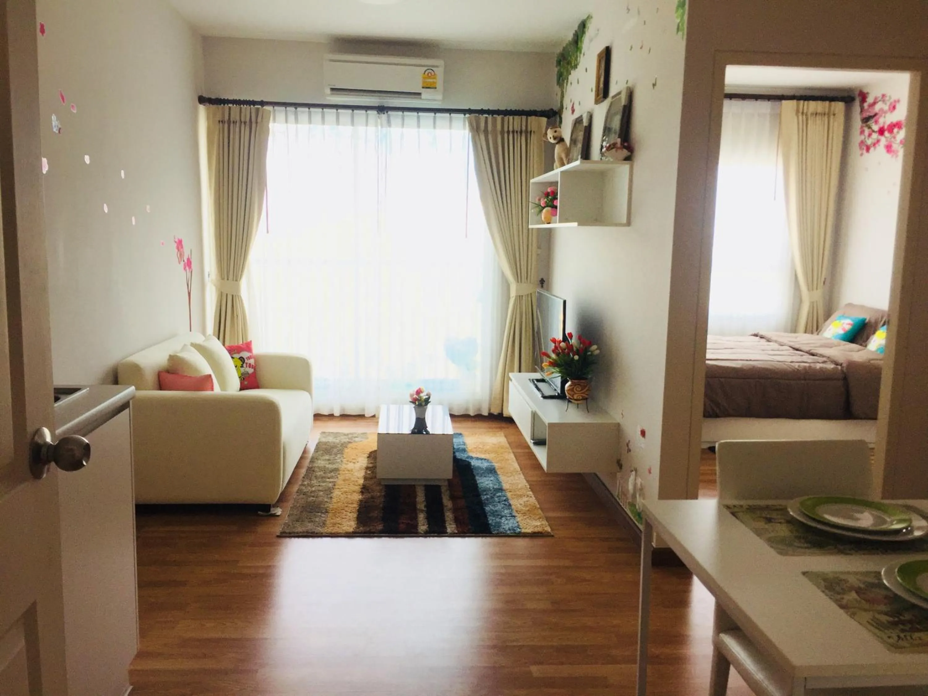 Living room in The Trust Condo Huahin by Petcharat