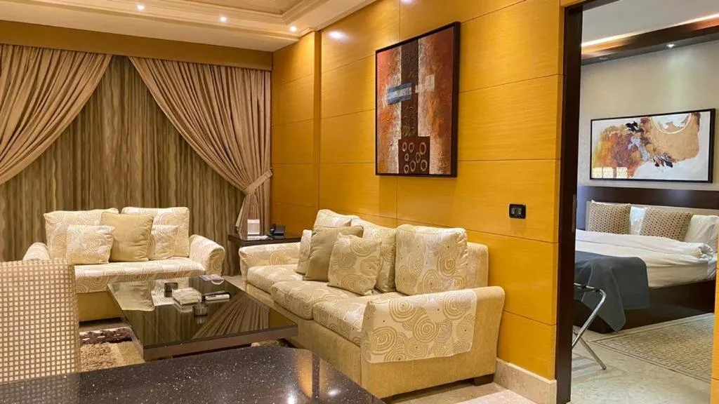 Seating area, Bed in Imperial Suites Hotel