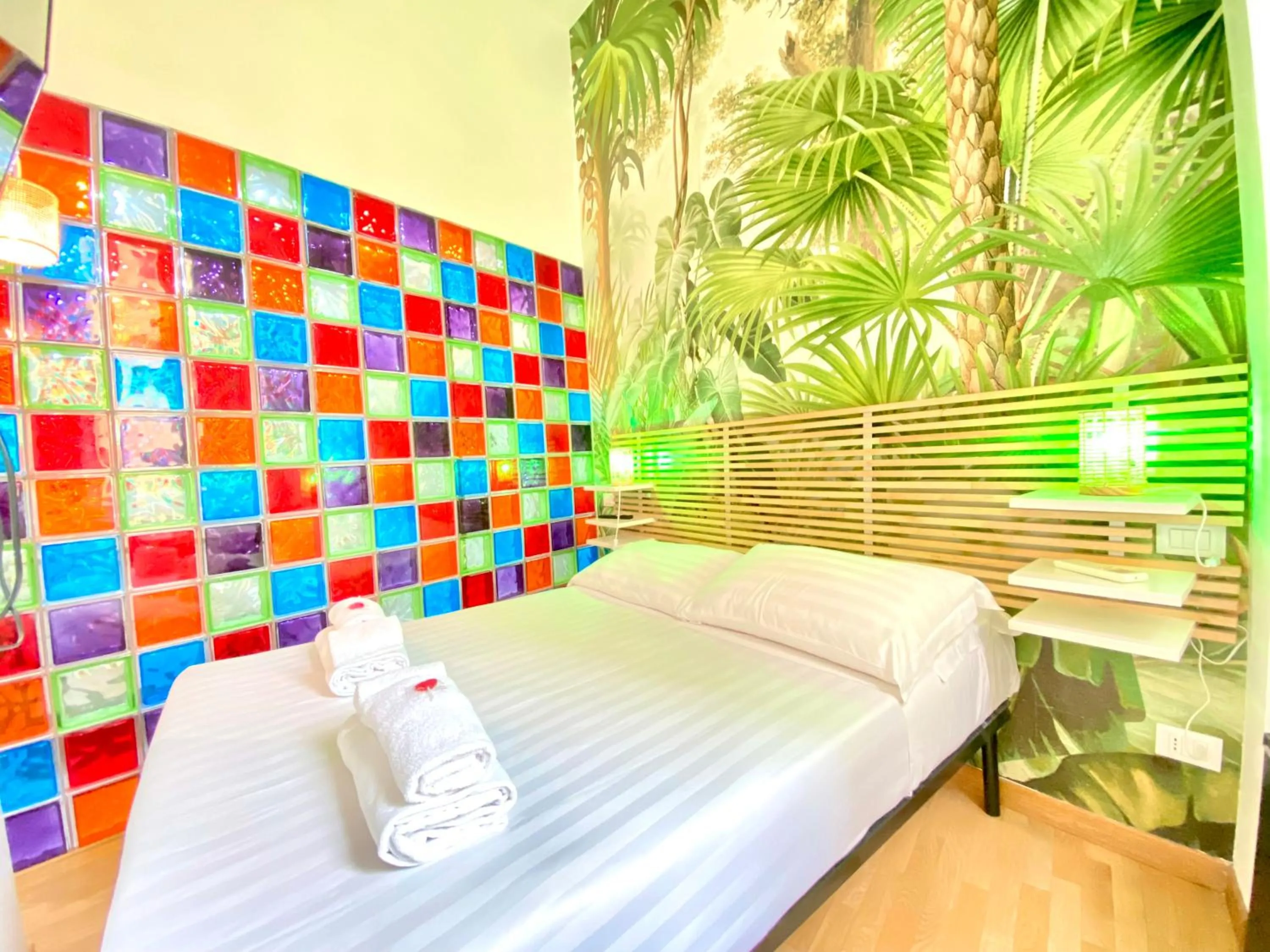 Bed in KISS ME ROME Luxury Rooms