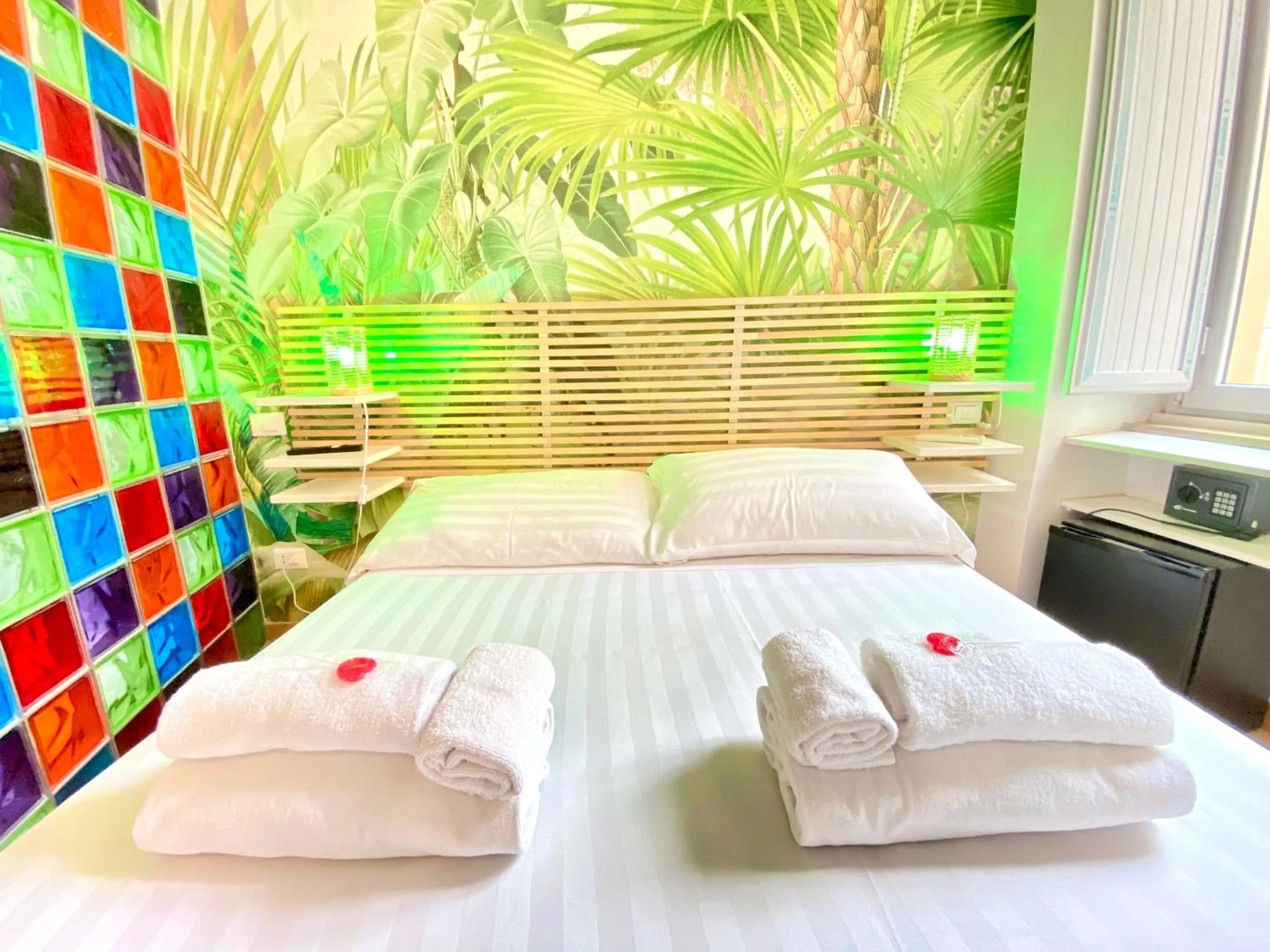 Bed in KISS ME ROME Luxury Rooms