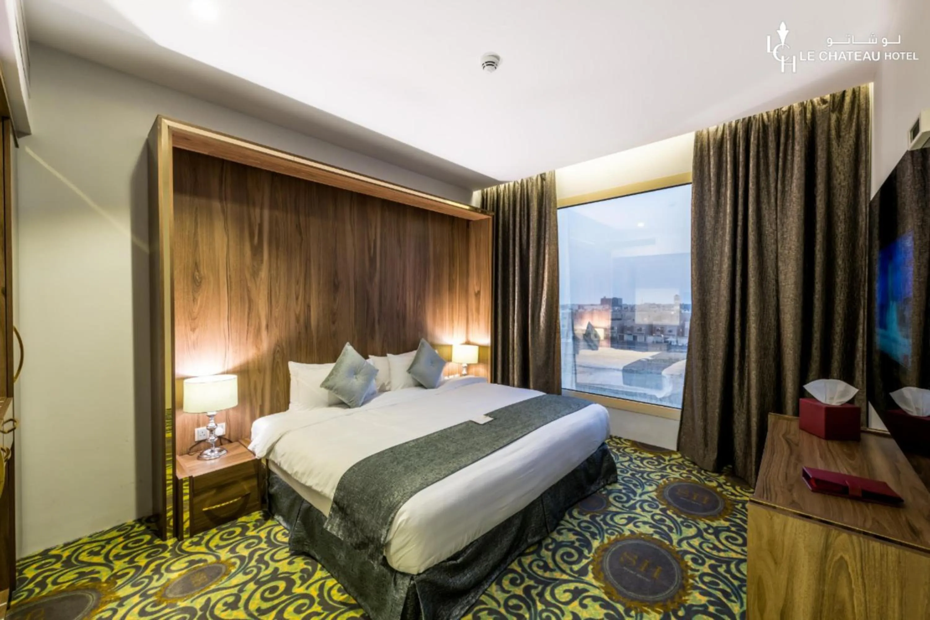 Bed in LeChateau Boutique Hotel