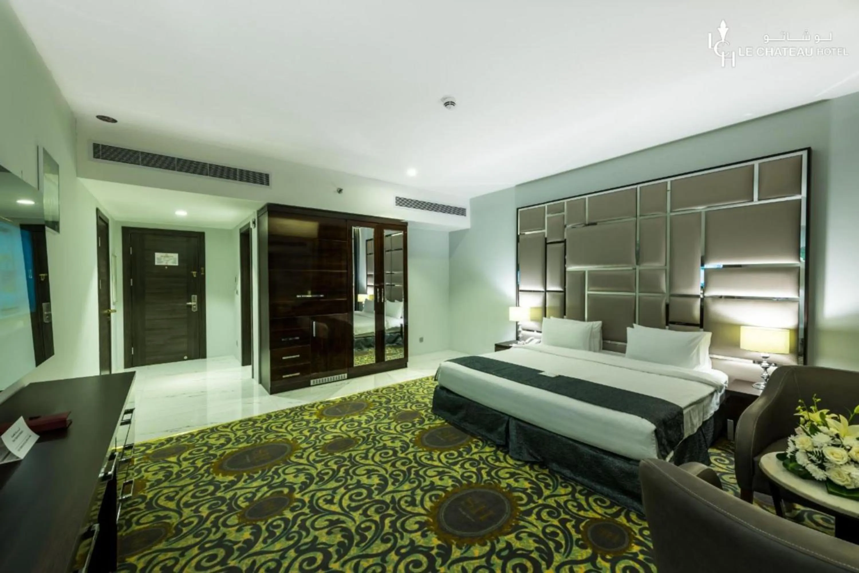 Bed in LeChateau Boutique Hotel