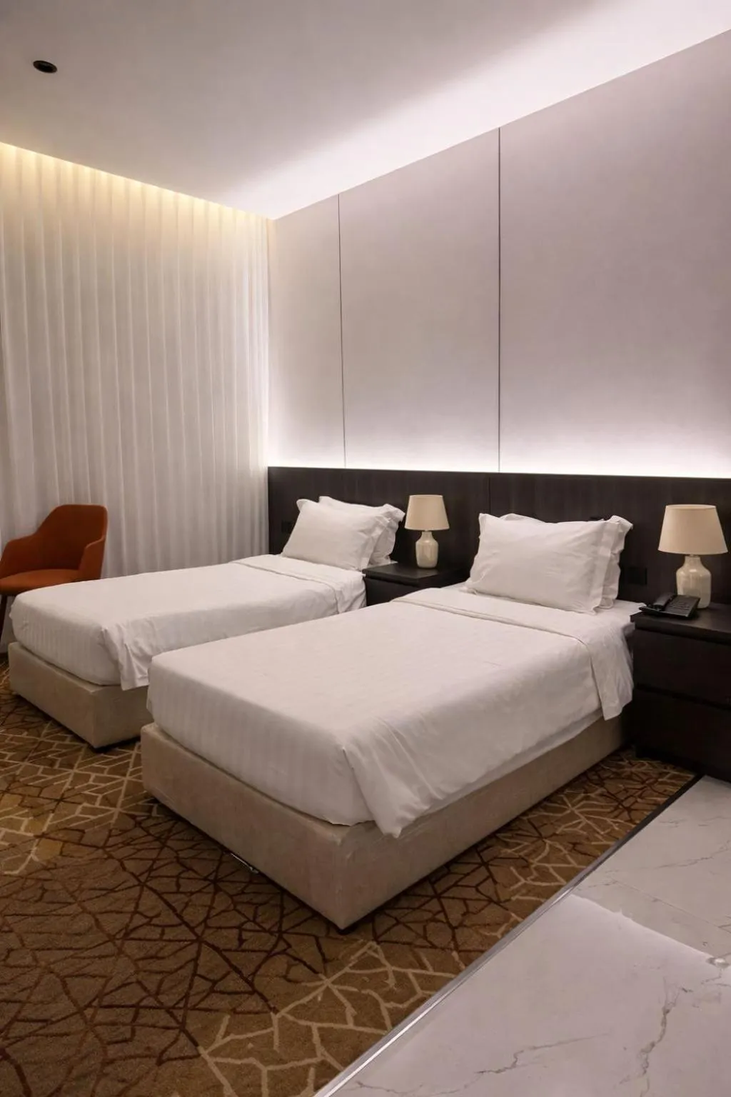 Bed in LeChateau Boutique Hotel