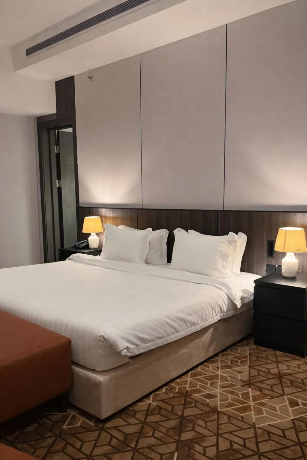 Bed in LeChateau Boutique Hotel