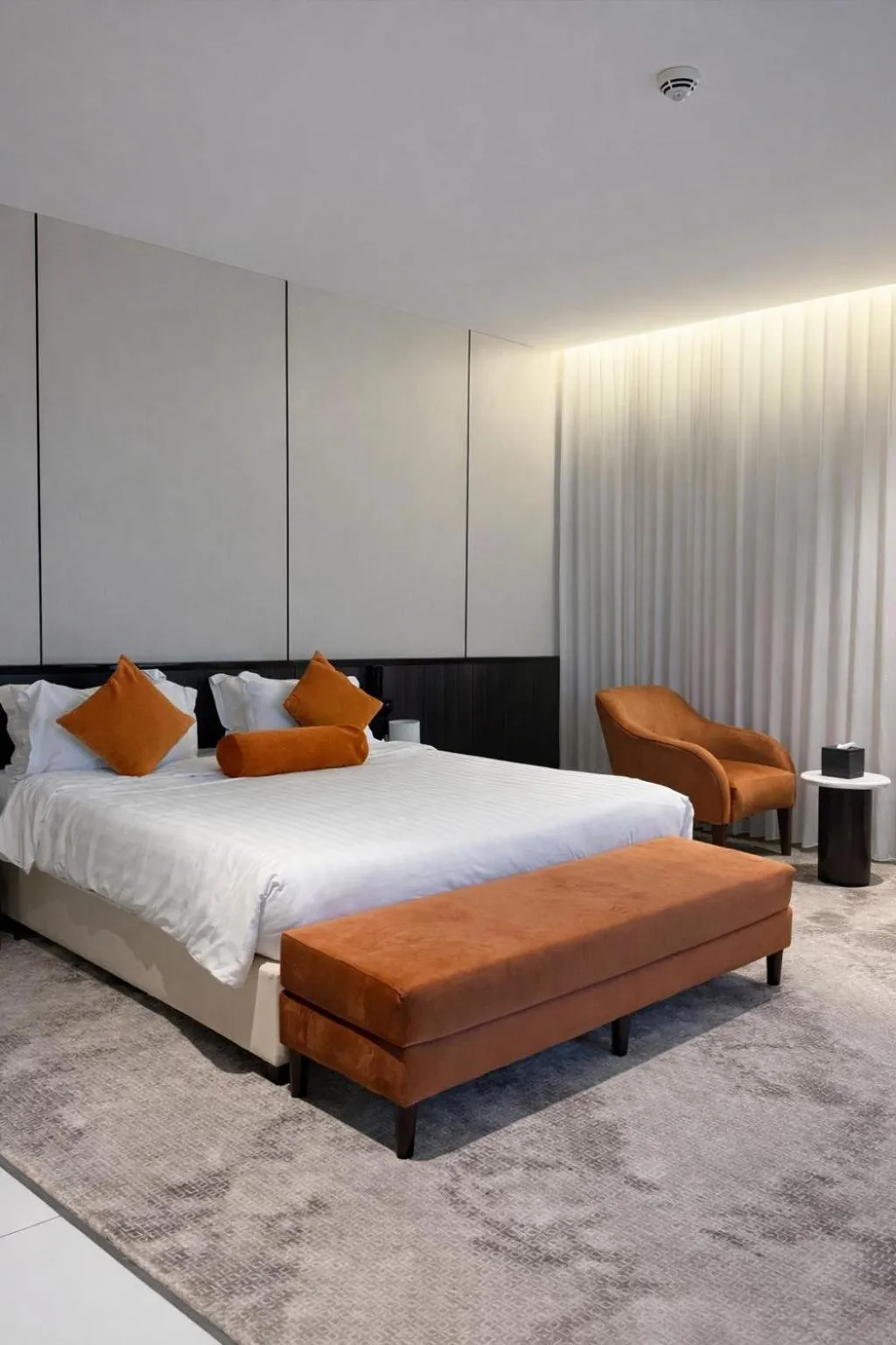 Bed in LeChateau Boutique Hotel