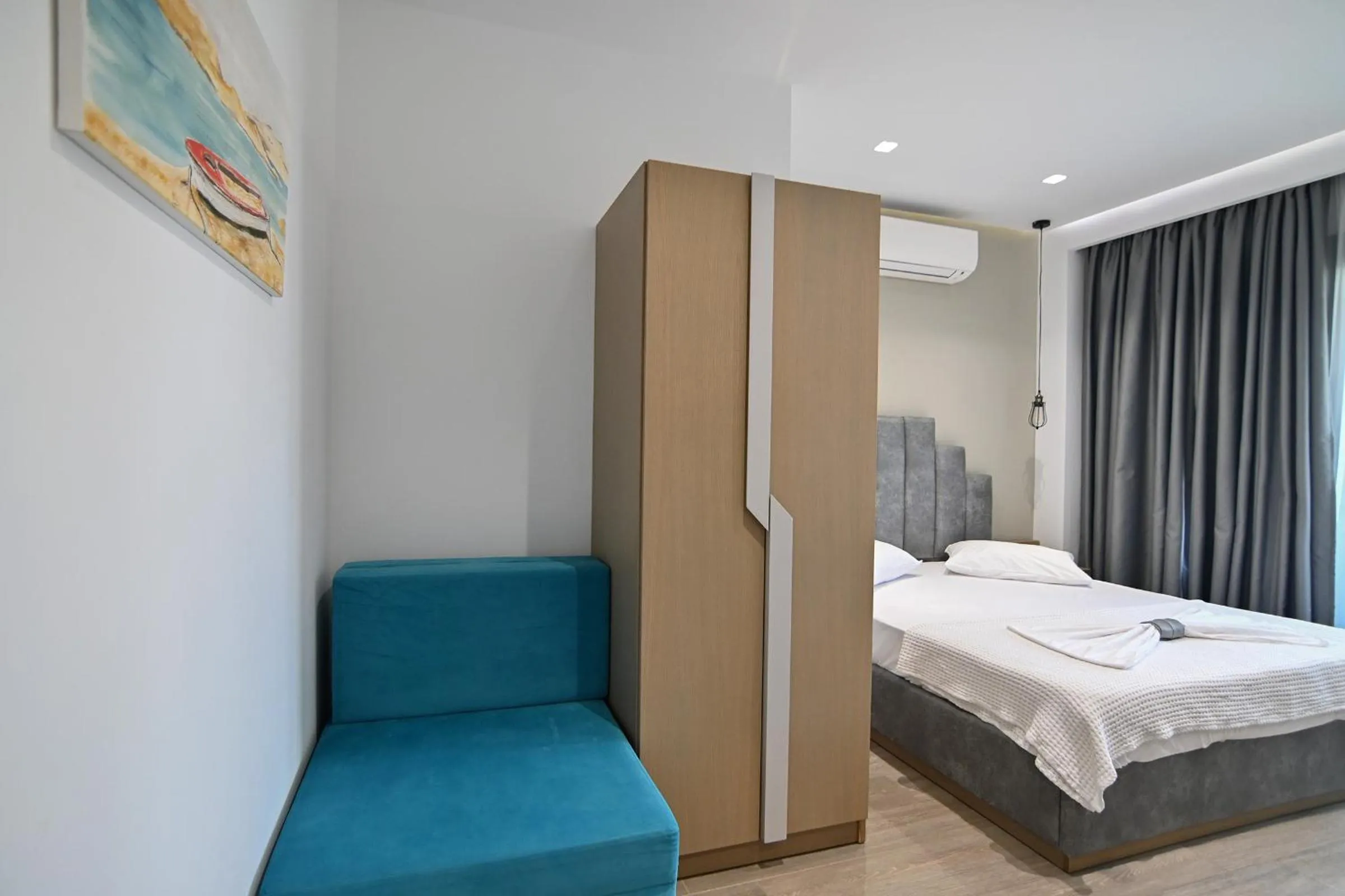 Bed in Amalia Rooms Sea View