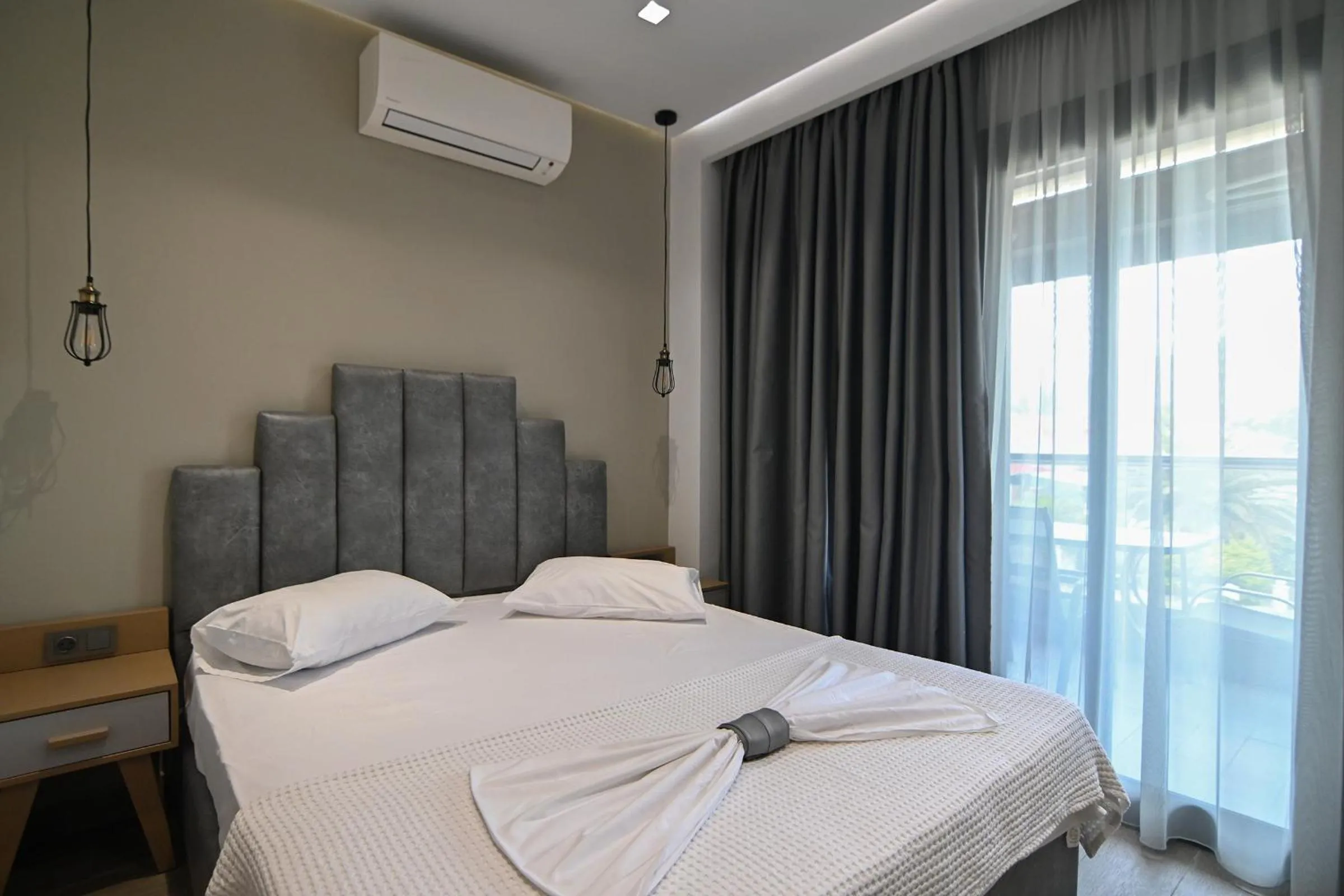 Bed in Amalia Rooms Sea View