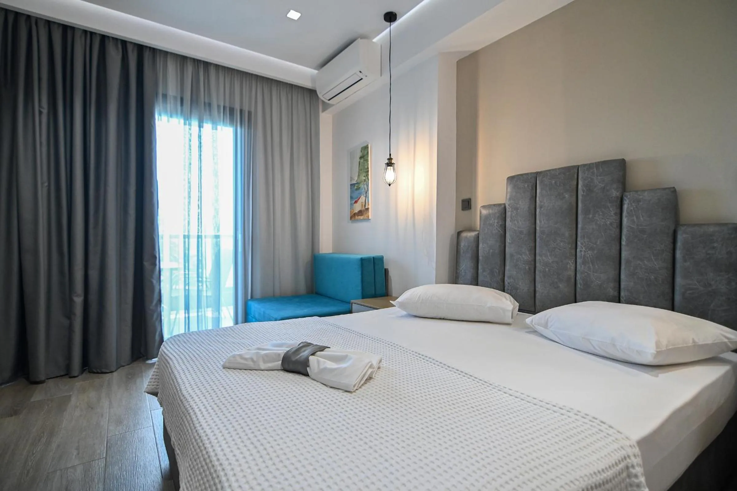 Bed in Amalia Rooms Sea View