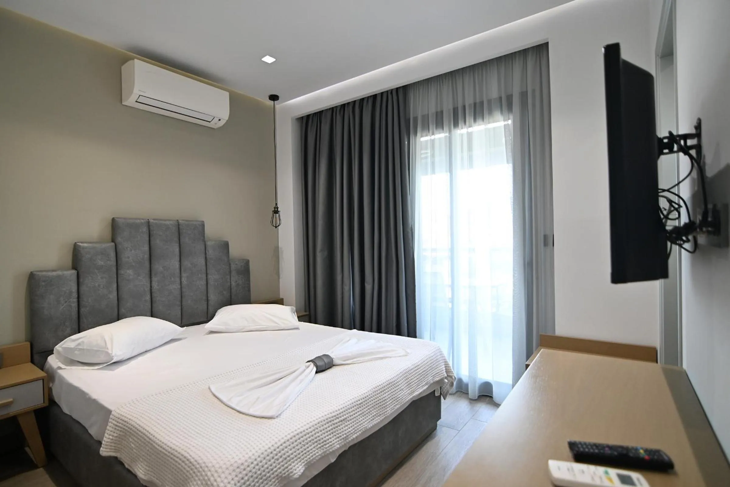 Bed in Amalia Rooms Sea View