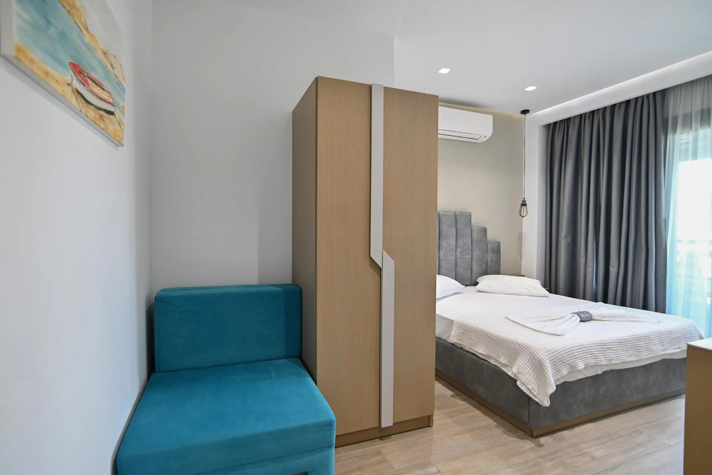 Bed in Amalia Rooms Sea View