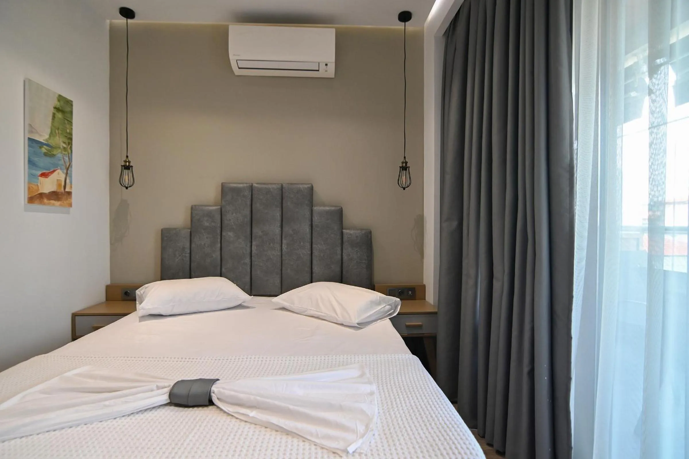 Bed in Amalia Rooms Sea View