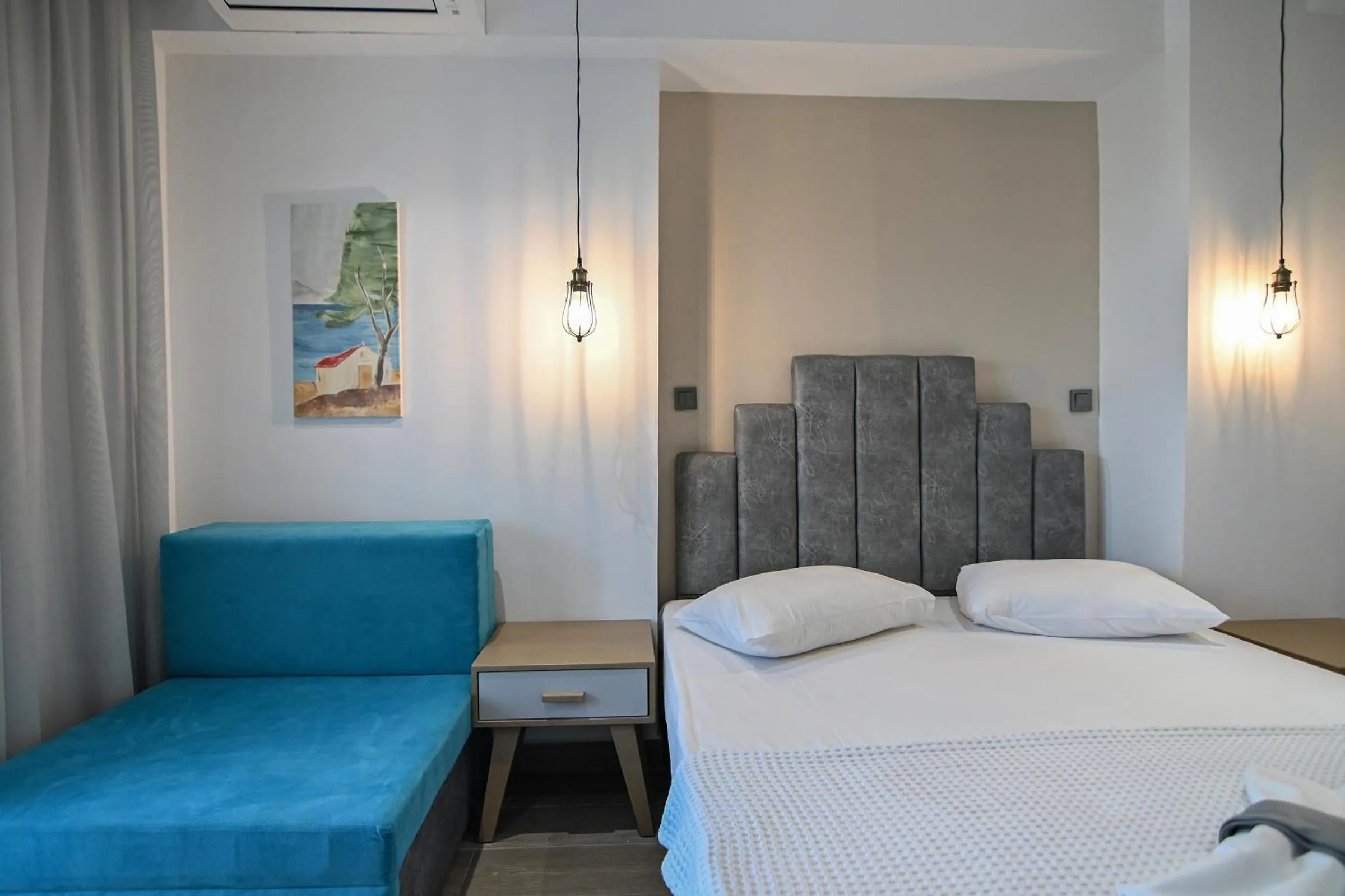 Bed in Amalia Rooms Sea View