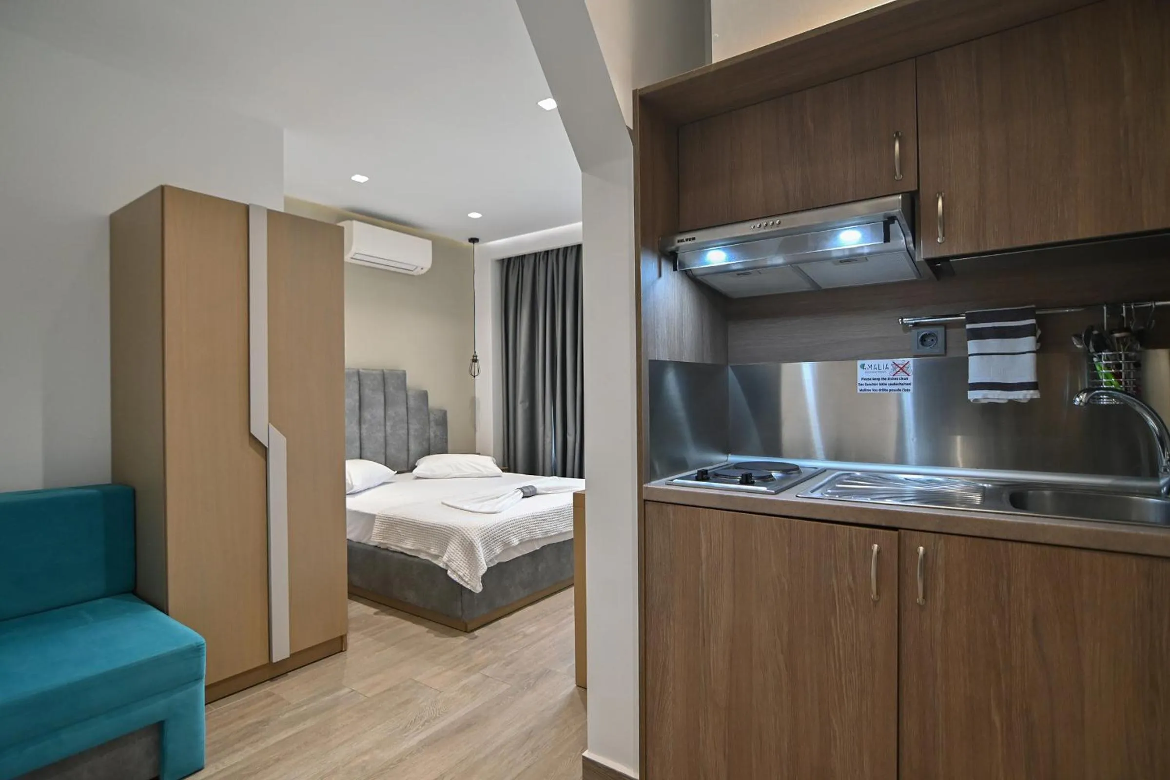 Bed in Amalia Rooms Sea View