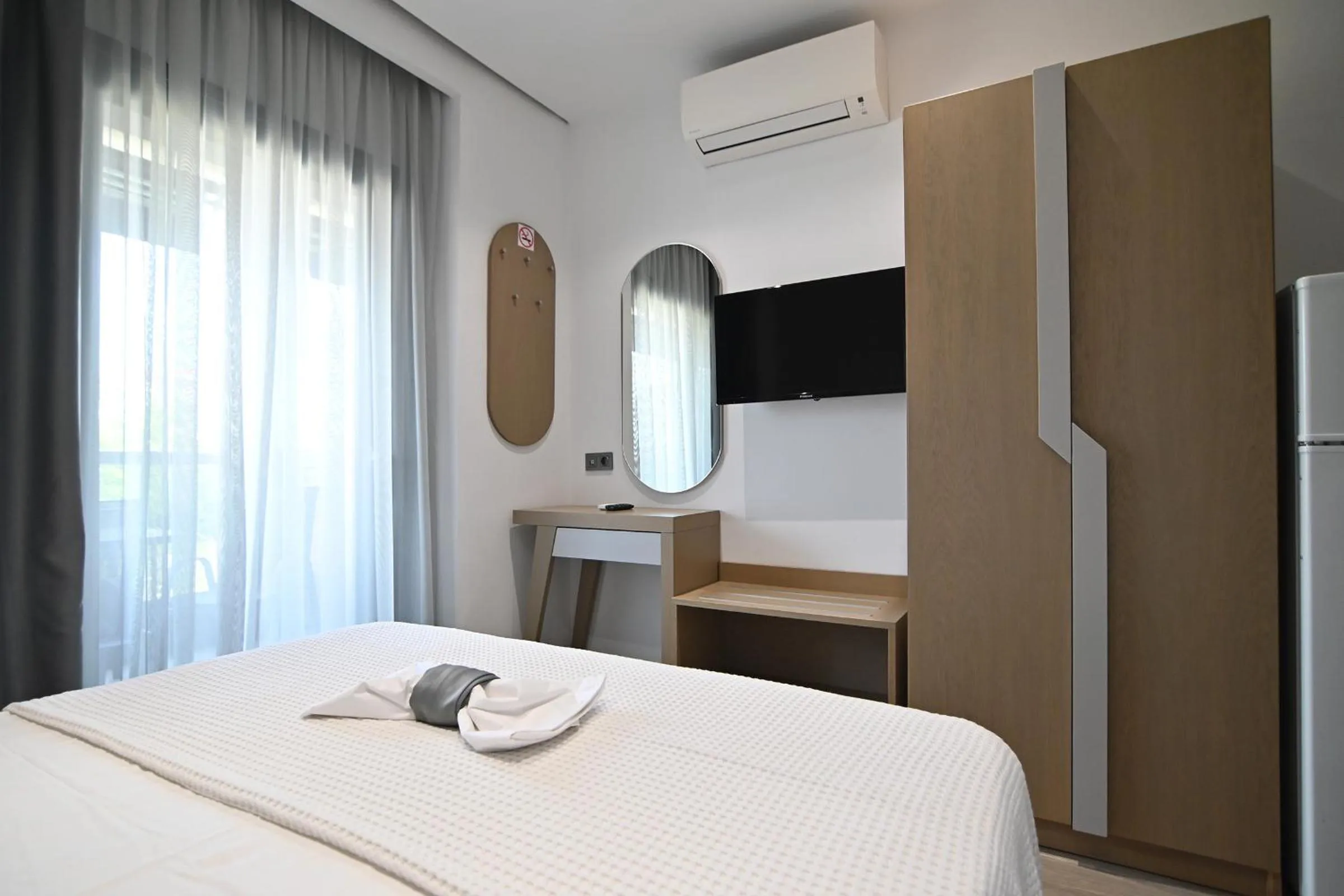 Bed in Amalia Rooms Sea View