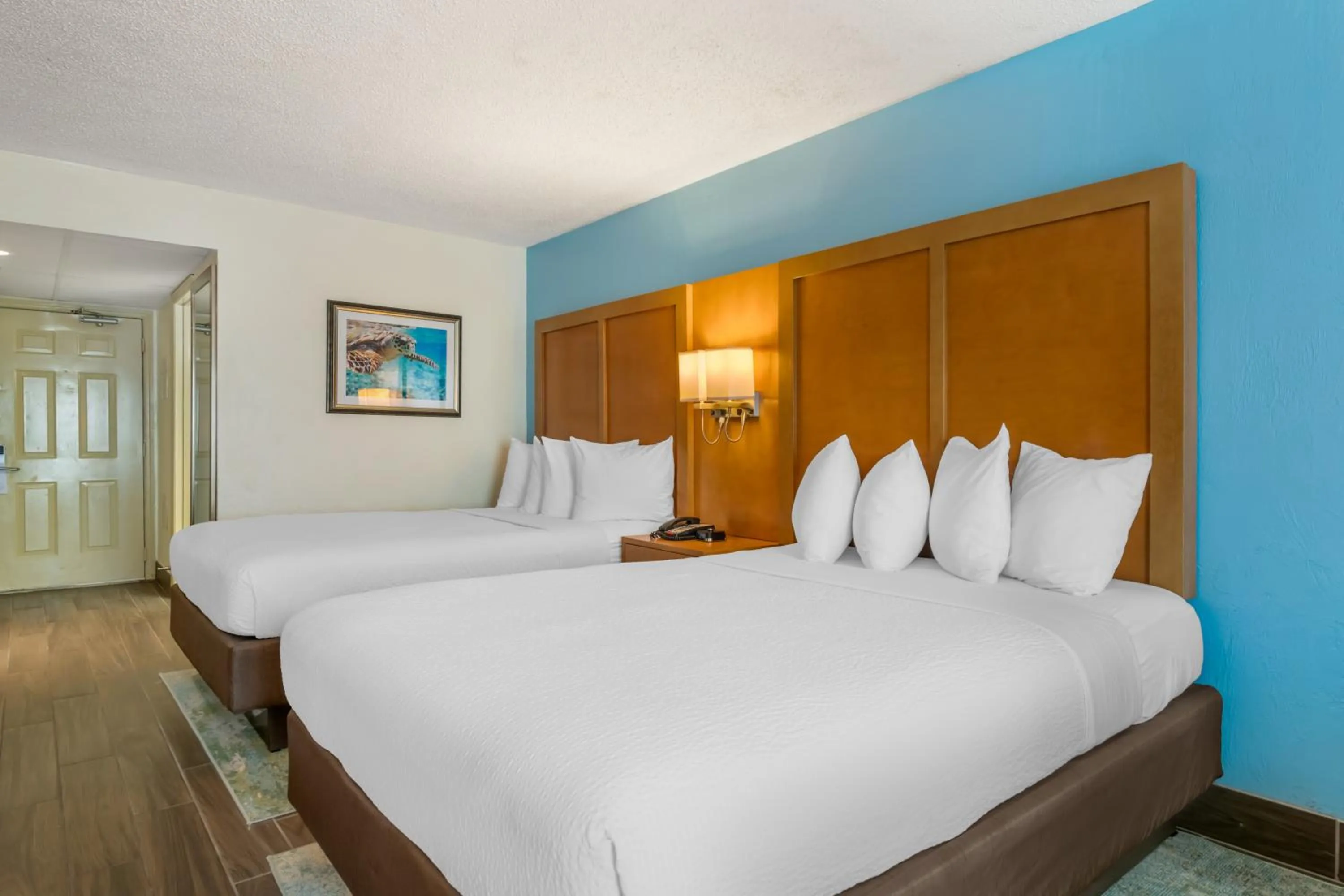 Bed in Tropical Winds Resort Hotel