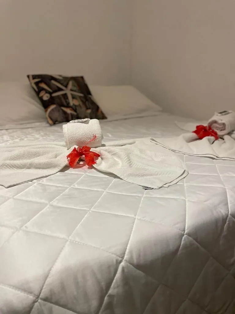 Bed in Pousada Corais Do Sul