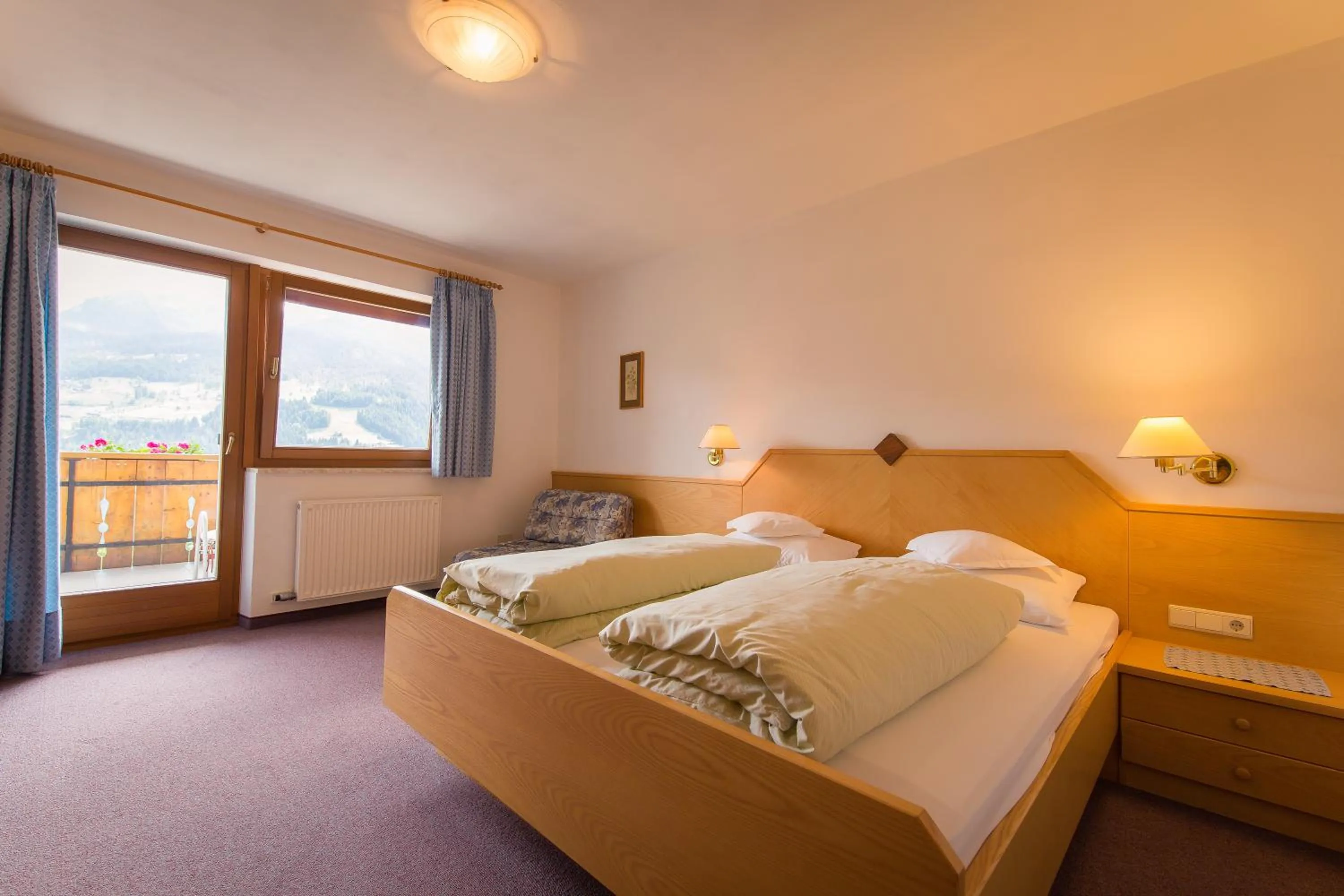 Bed in Hotel Alpenland