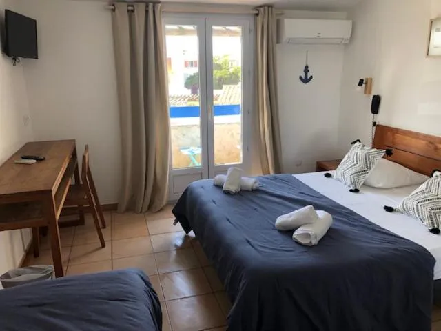 Bed in Hotel Le Bleu Marine