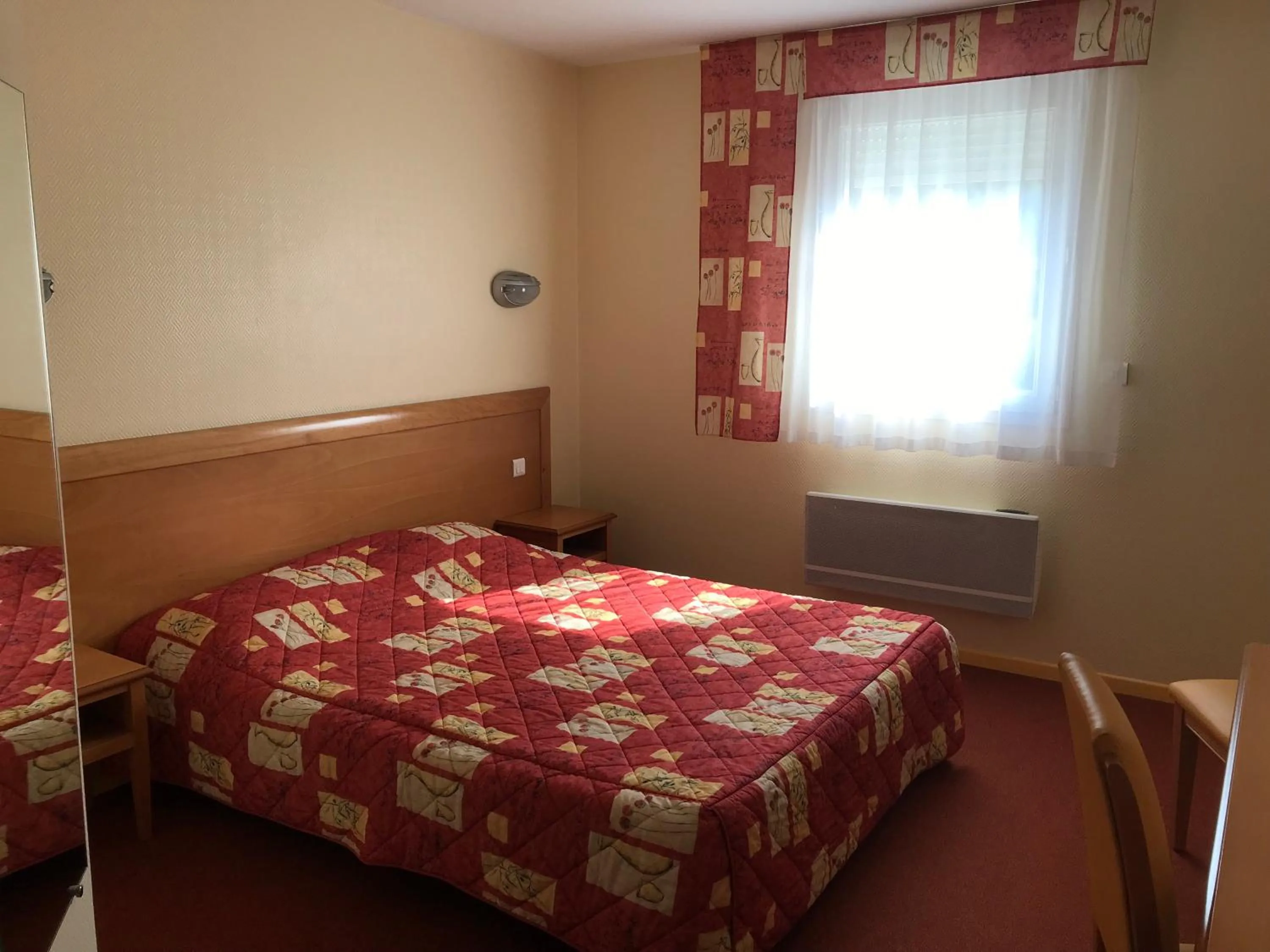 Bed in Hôtel La Colombiere Cantal