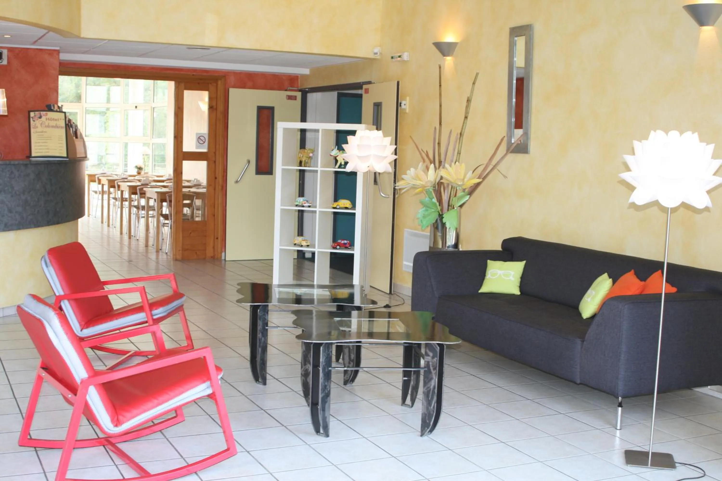 Communal lounge/ TV room in Hôtel La Colombiere Cantal