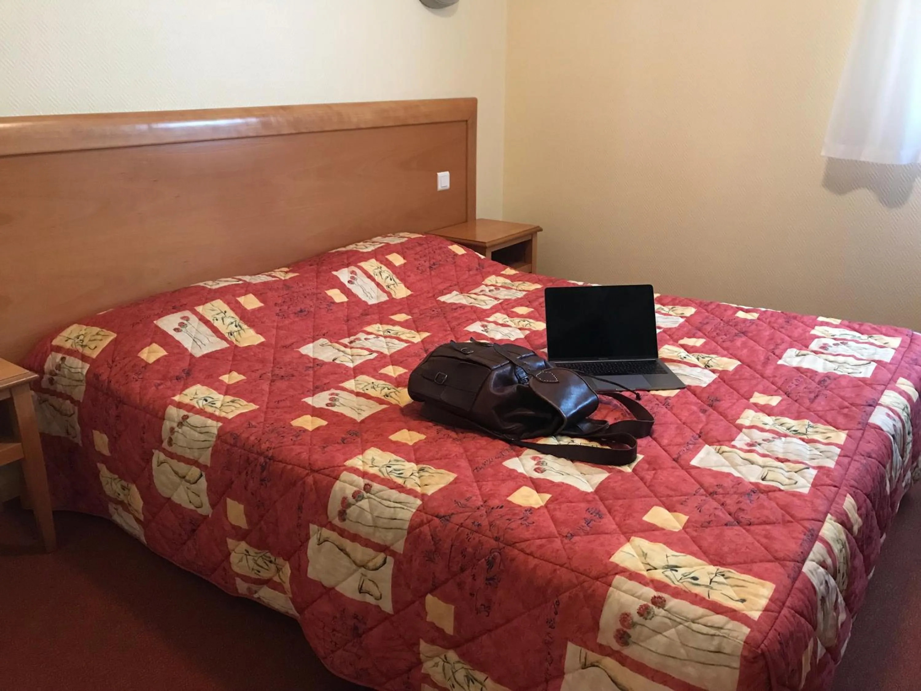 Bed in Hôtel La Colombiere Cantal
