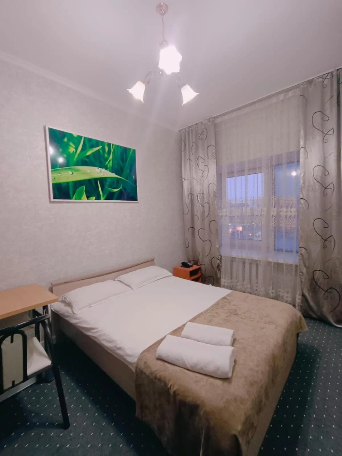 Bed in Altyn-Adam Hotel