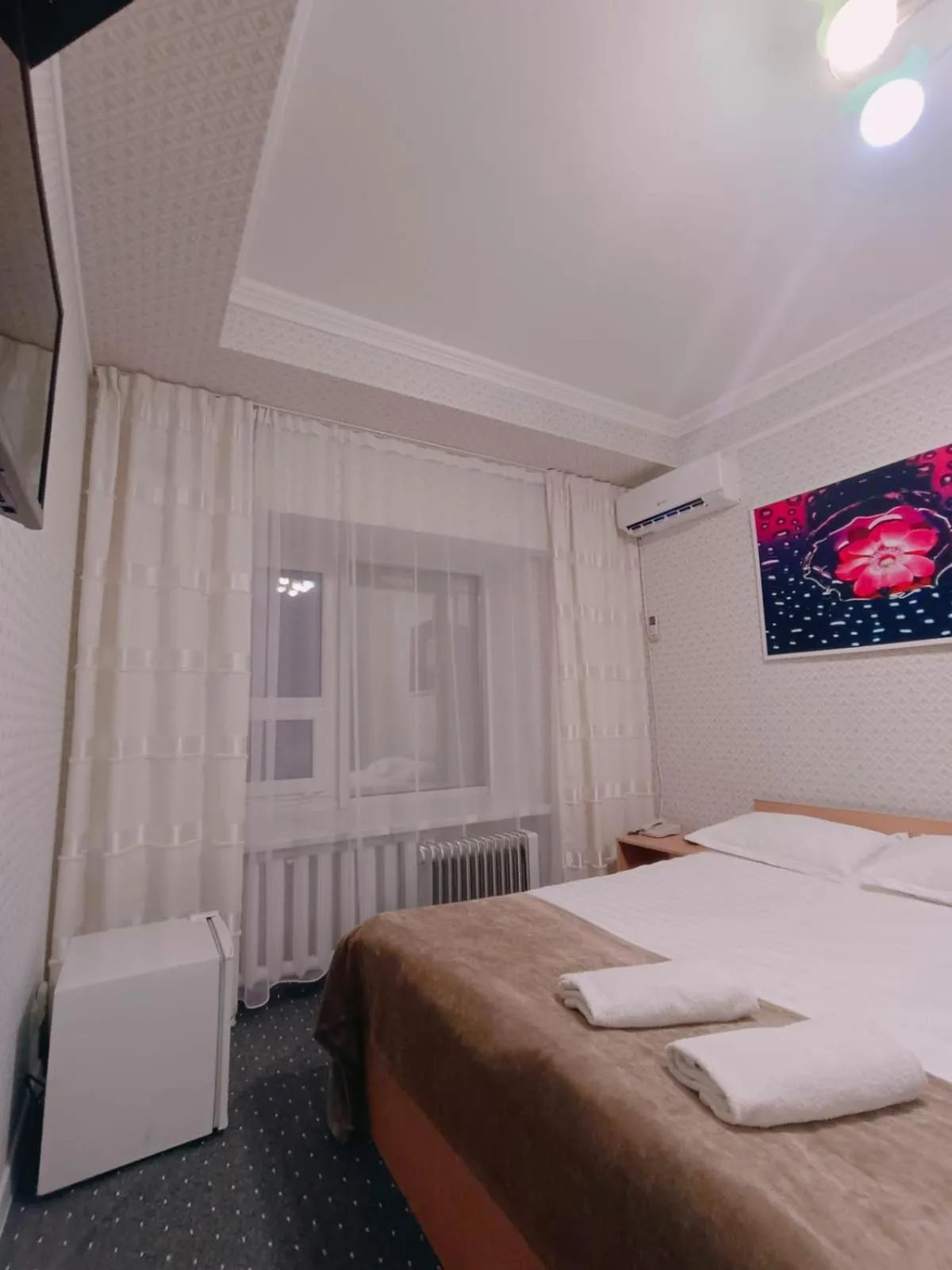 Bed in Altyn-Adam Hotel