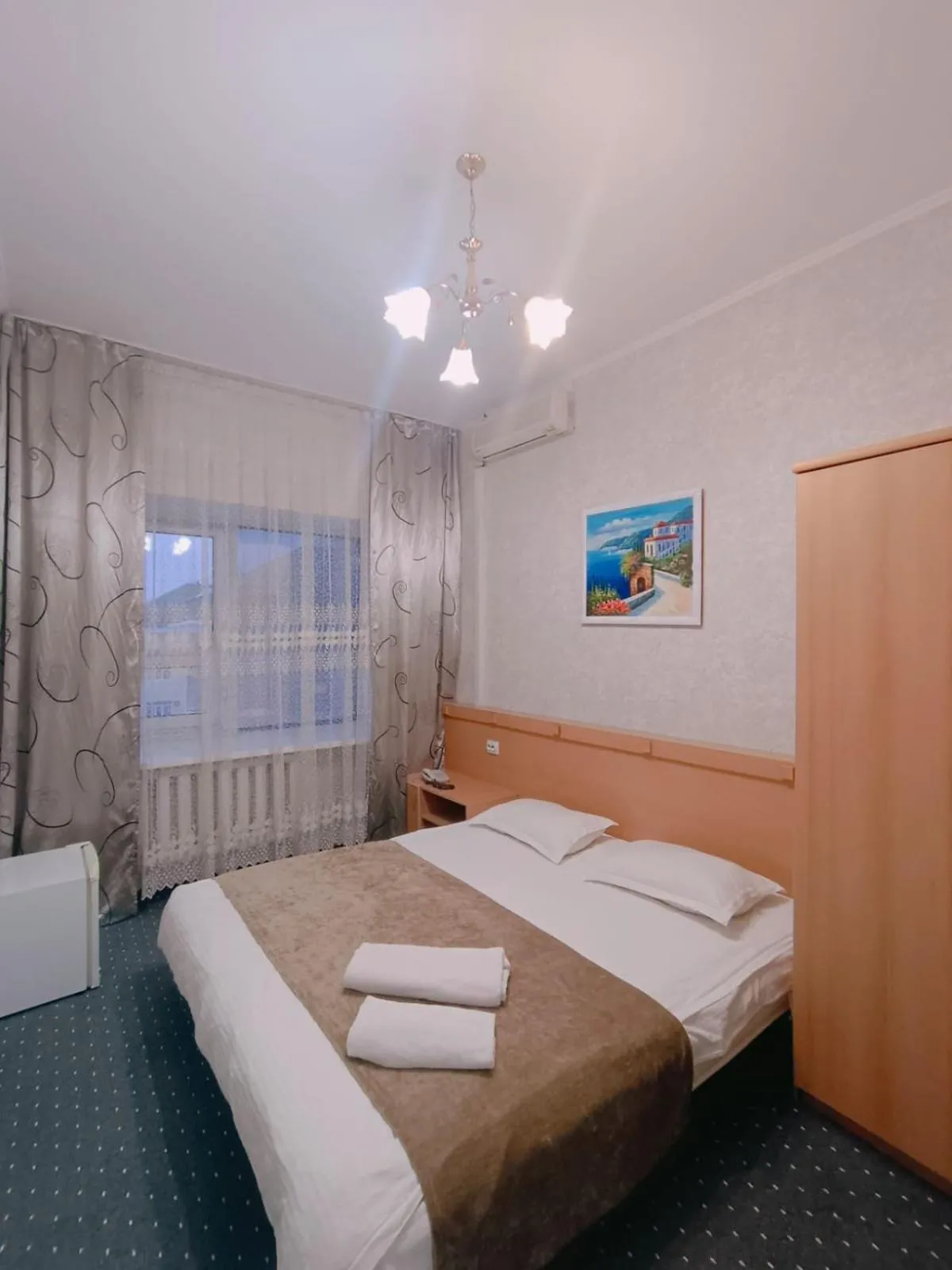 Bed in Altyn-Adam Hotel