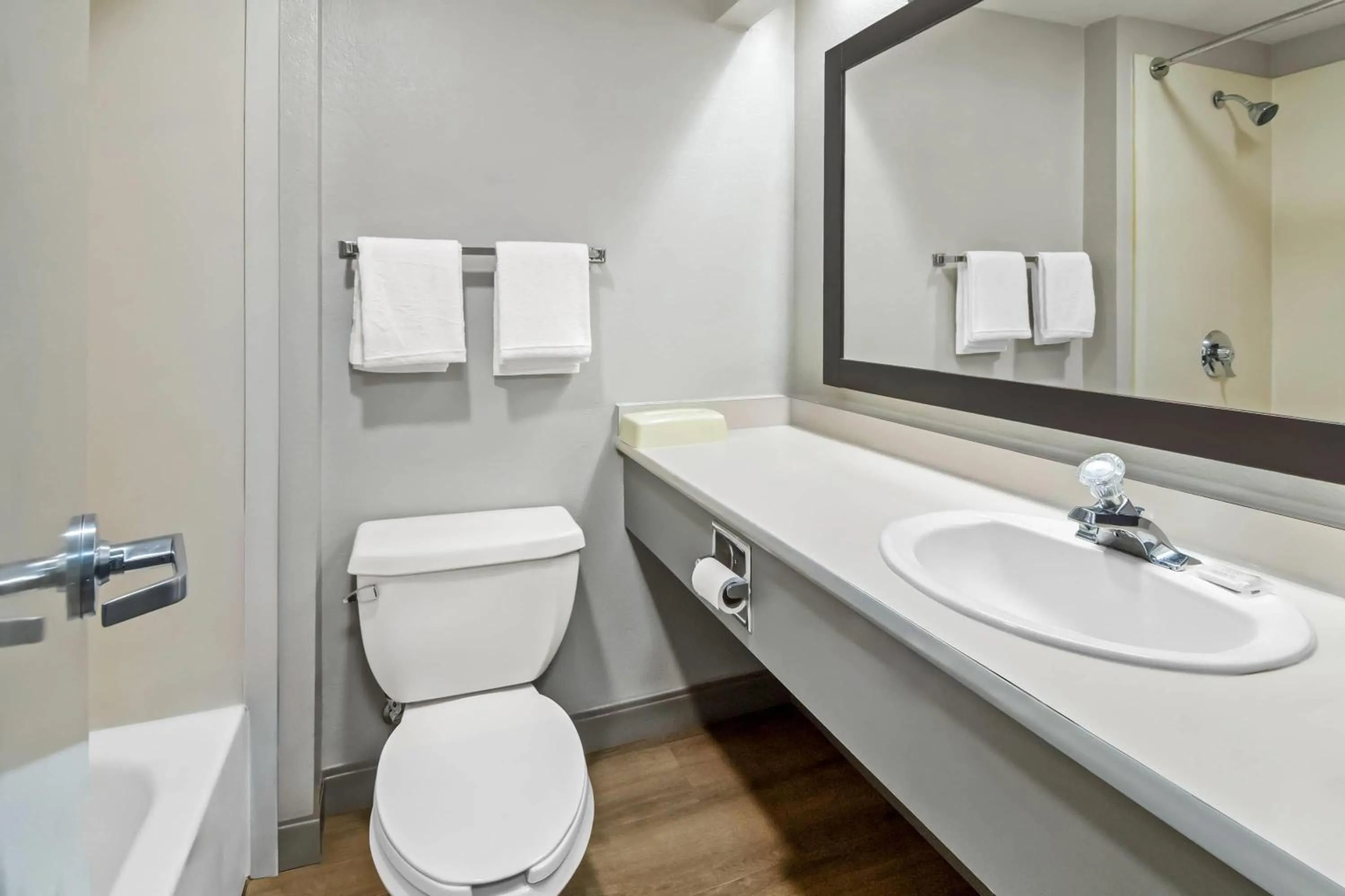 Bathroom in Days Inn & Suites by Wyndham DeSoto