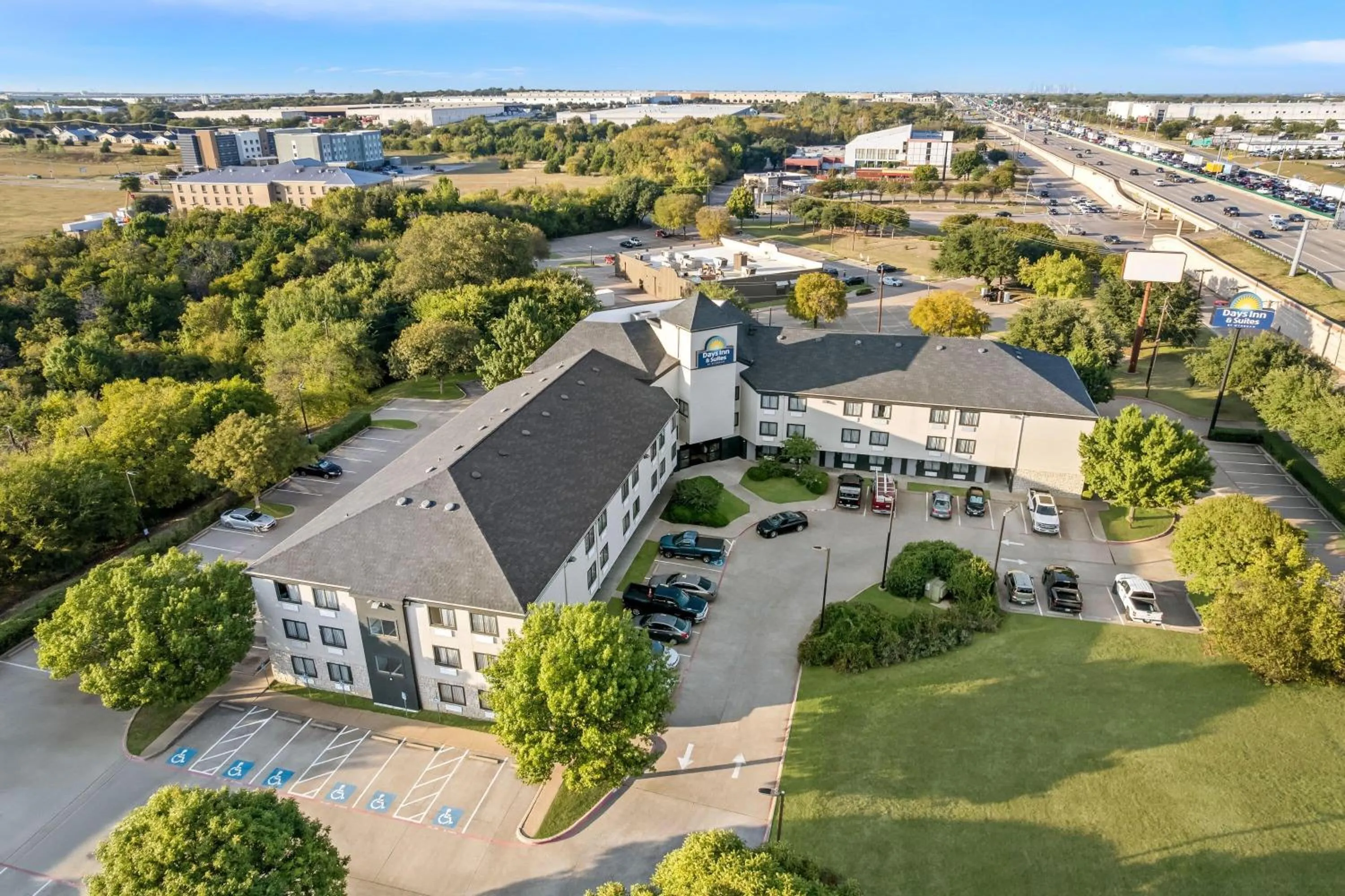 Property building in Days Inn & Suites by Wyndham DeSoto