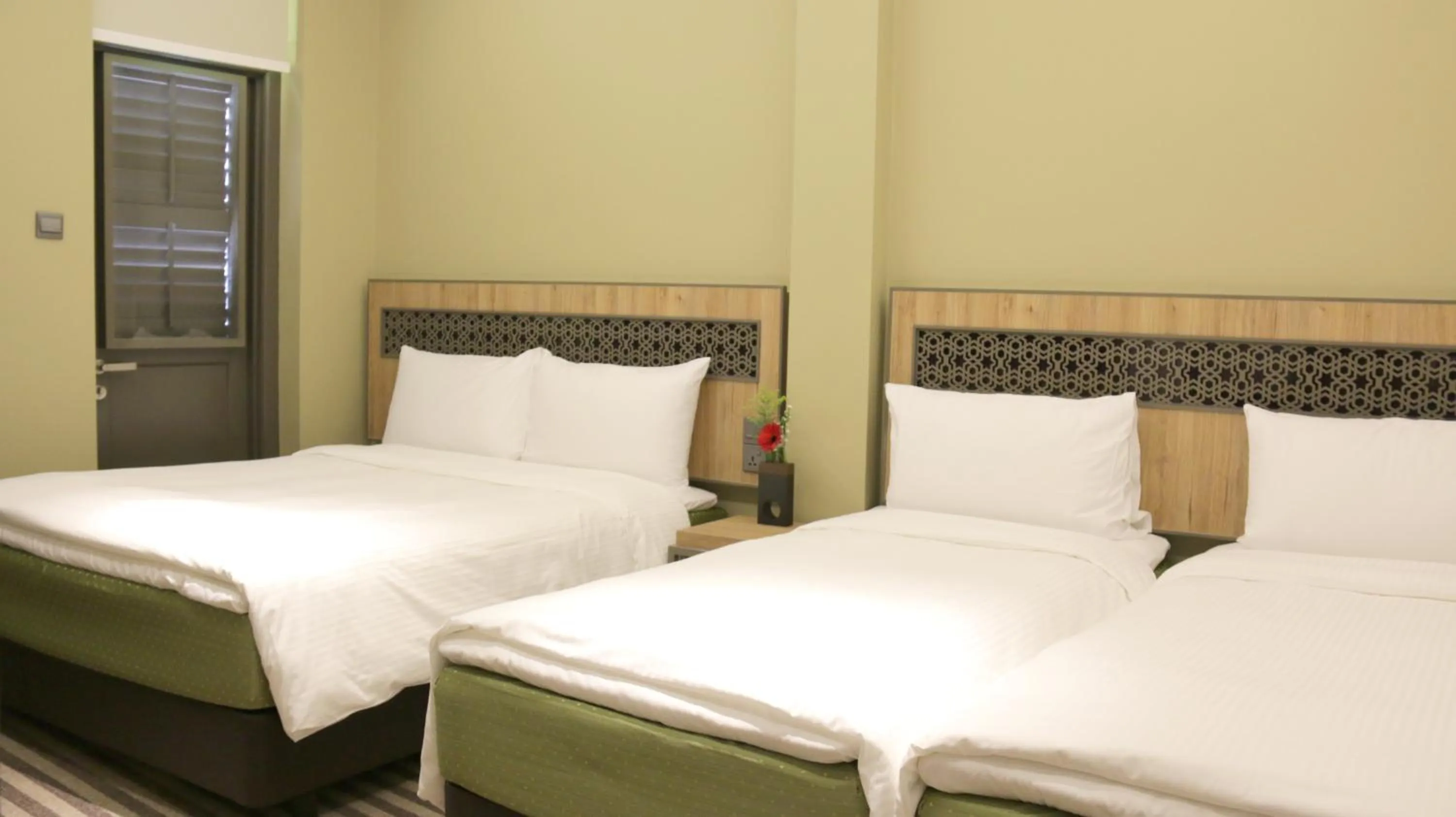 Bedroom in Aqueen Heritage Hotel Little India